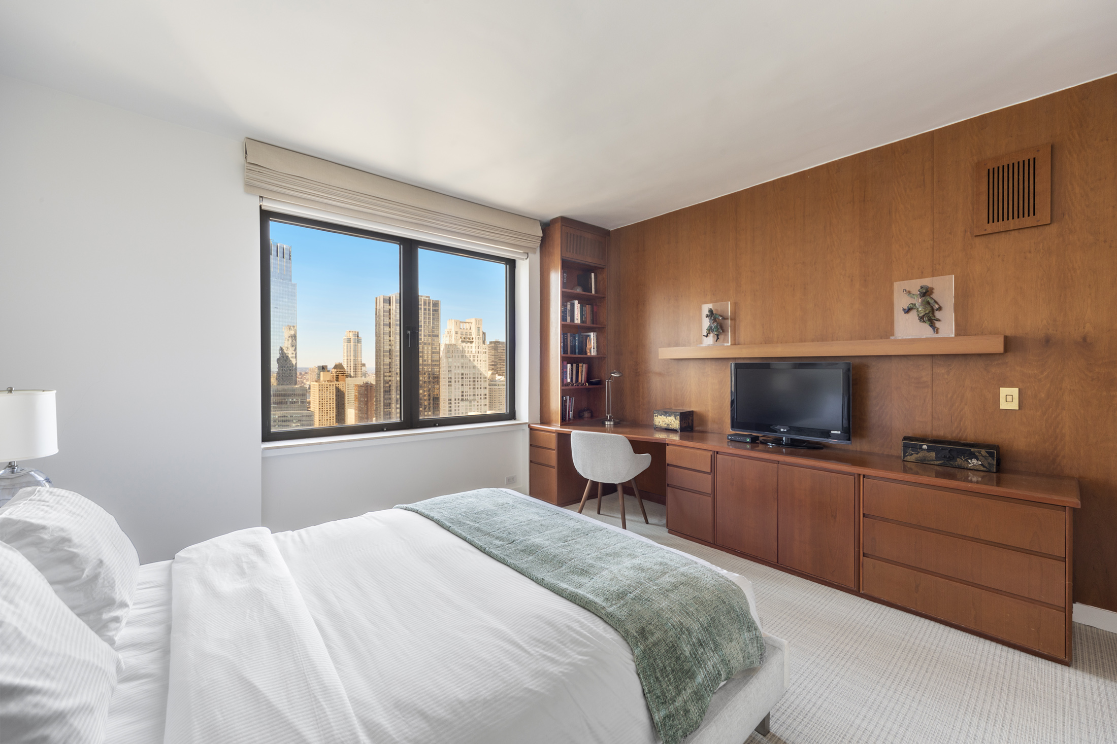 160 Central Park South, Unit 3903 Manhattan, NY 10019 - Photo 6 of 11 a bedroom with a bed and wooden floor