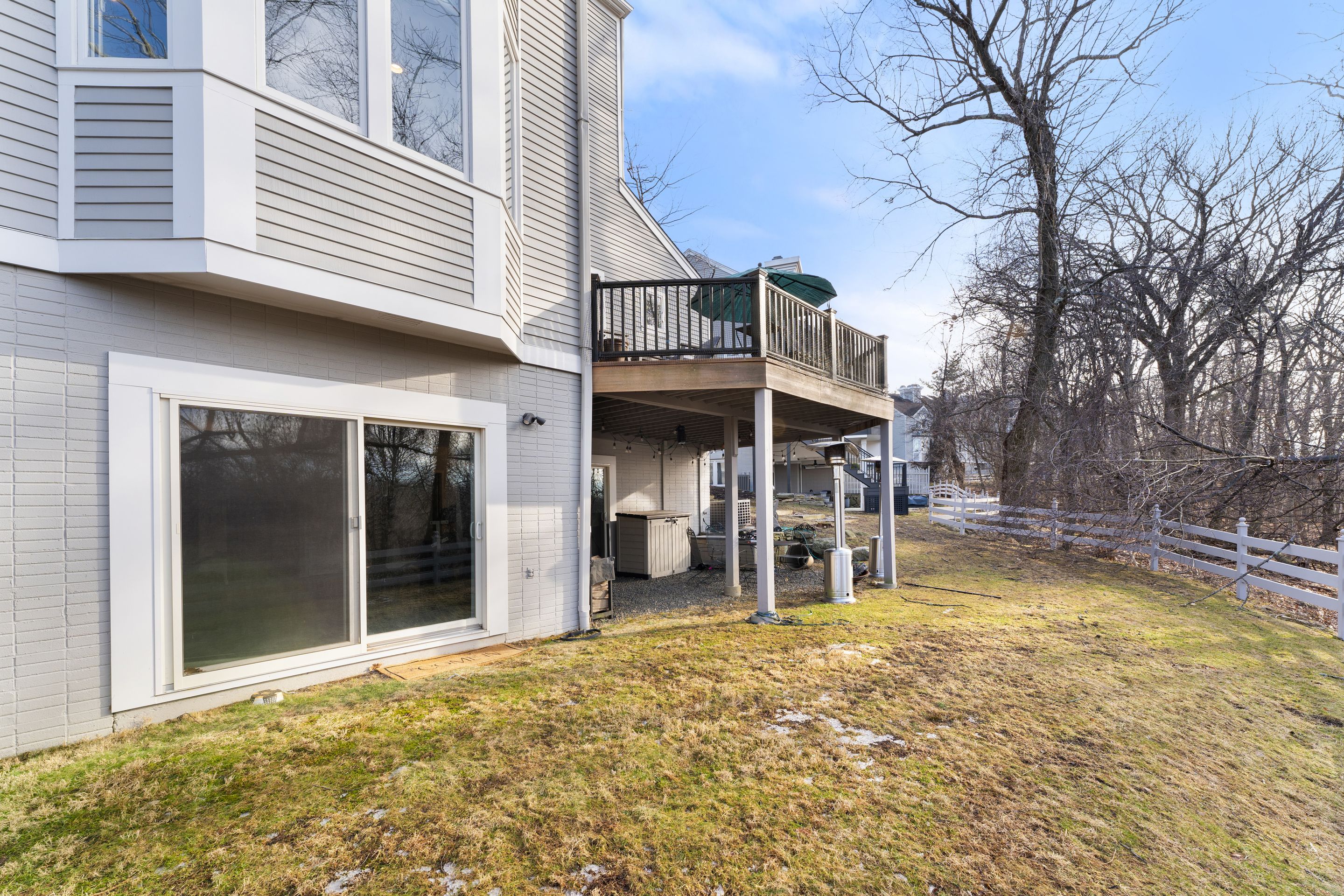 124 Boulder Ridge Road Scarsdale, NY 10583 - Photo 24 of 31 a view of a house with a swimming pool and sitting area