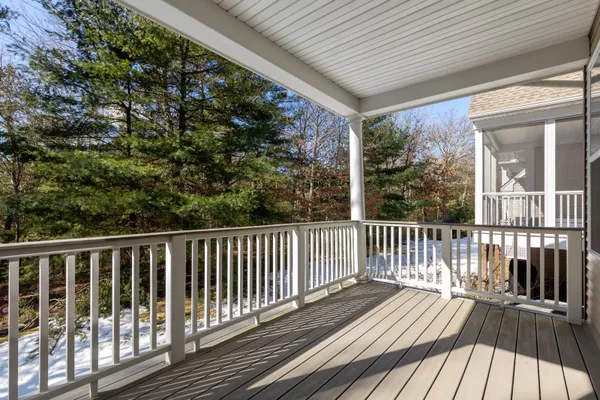 a view of balcony with wooden floor