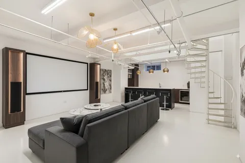 a room with furniture and a ceiling fan