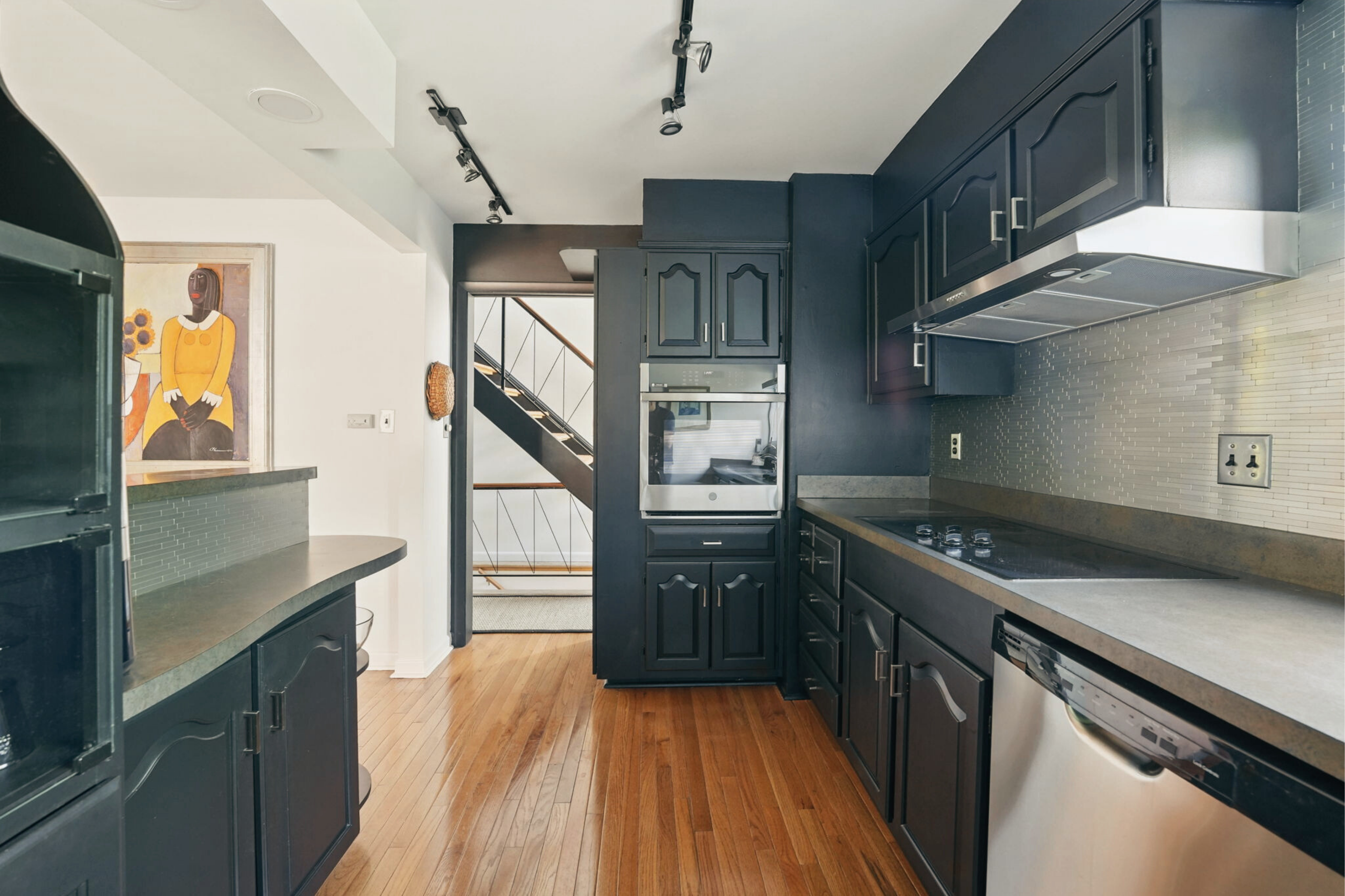 8003 16th Street Northwest Washington, DC 20012 - Photo 16 of 38 a kitchen with stainless steel appliances granite countertop a stove and a refrigerator