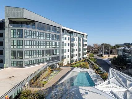 a view of balcony with a couple of swimming pool