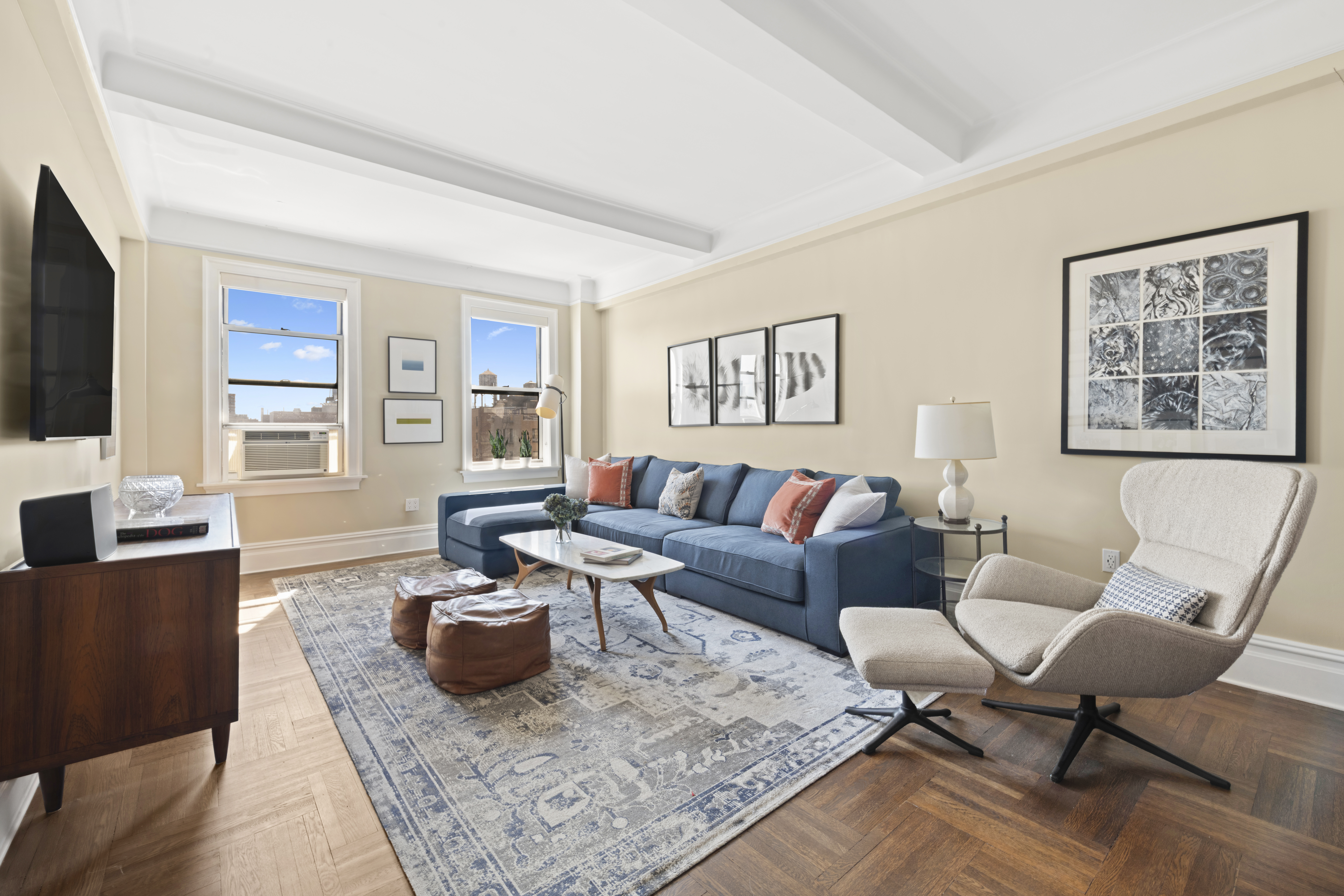 a living room with furniture and a flat screen tv