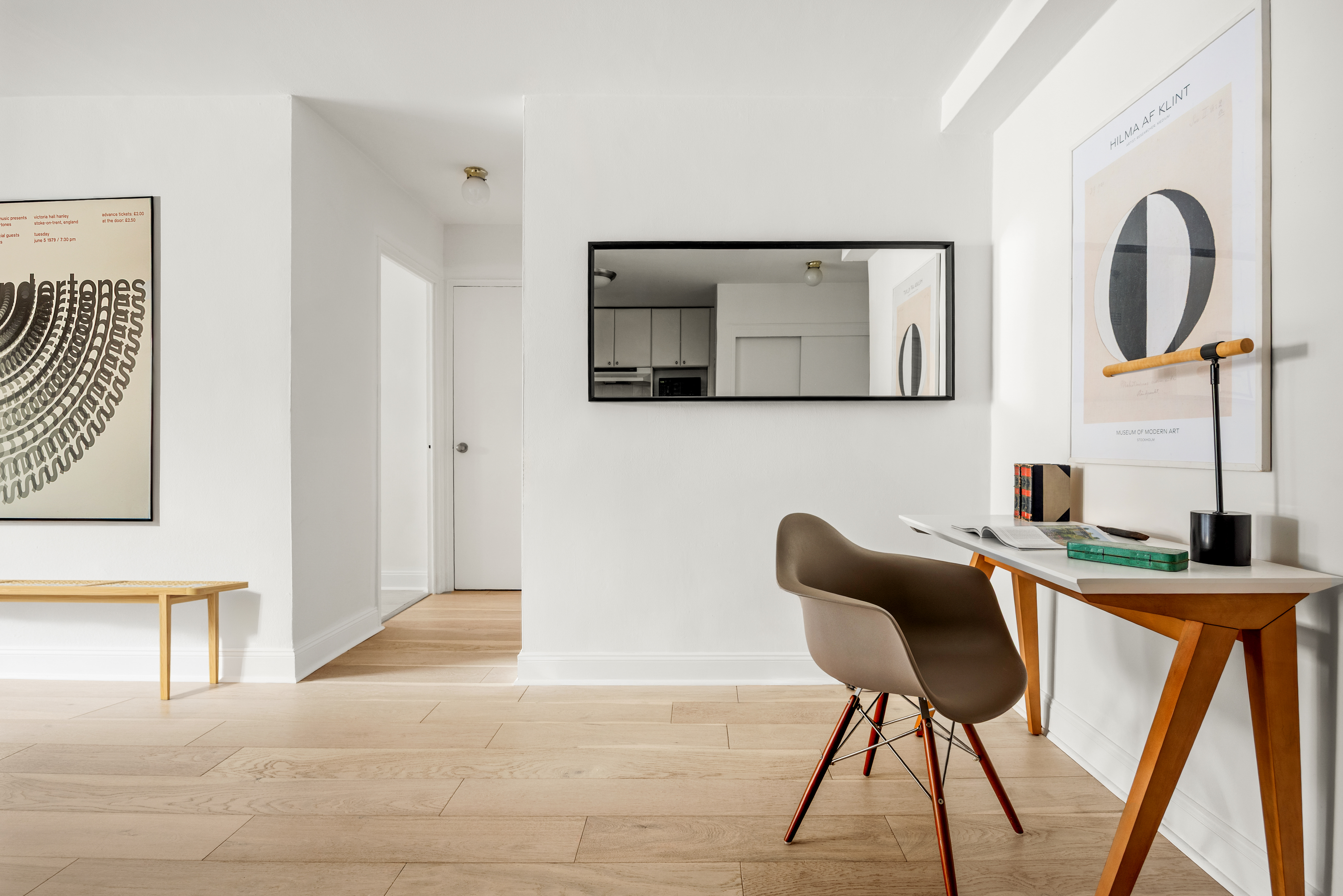 15 Charles Street, Unit 2H Manhattan, NY 10014 - Photo 5 of 12 a view of a workspace with furniture and mirror