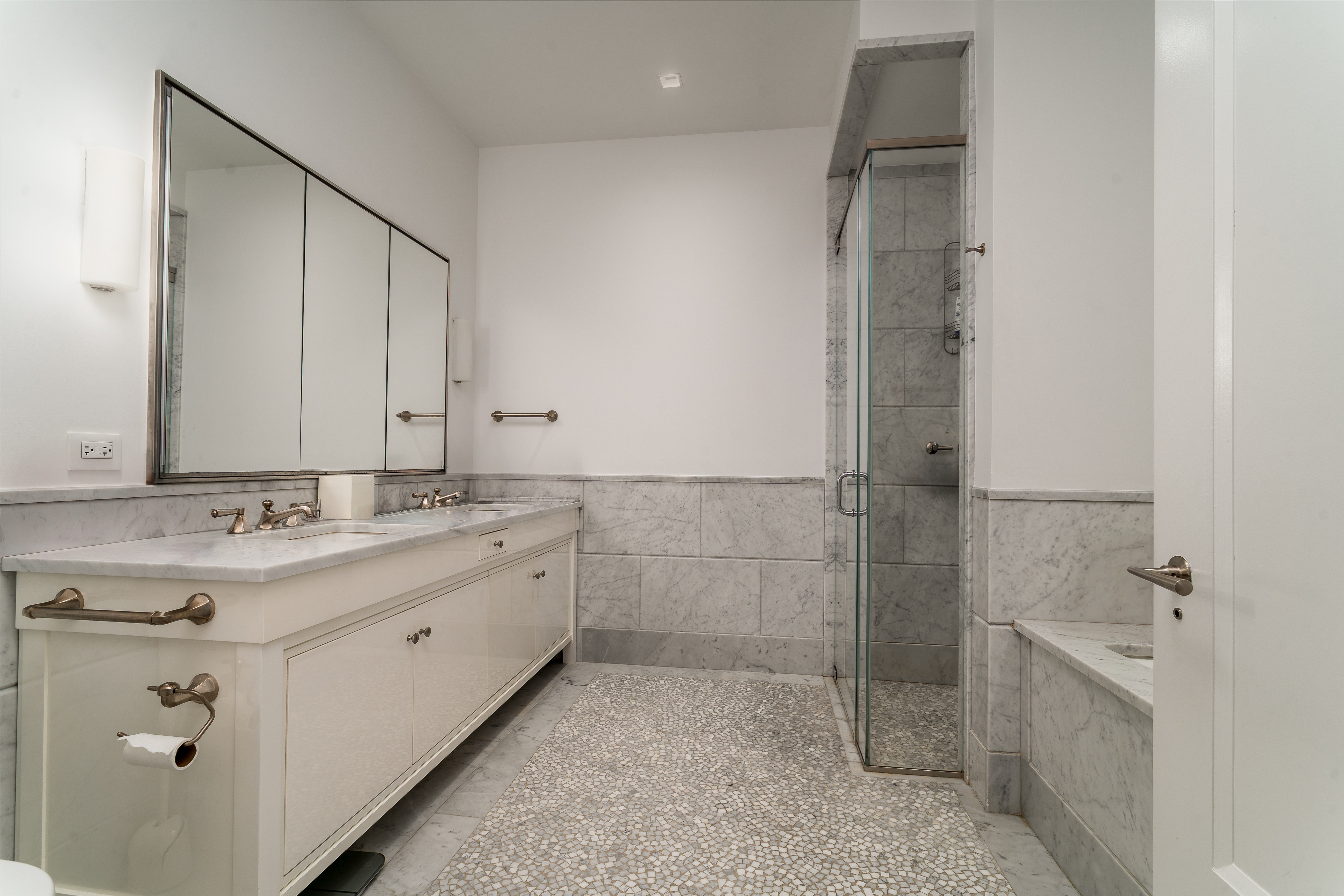 10 Madison Square West, Unit 16F Manhattan, NY 10010 - Photo 11 of 15 a bathroom with a shower and a sink