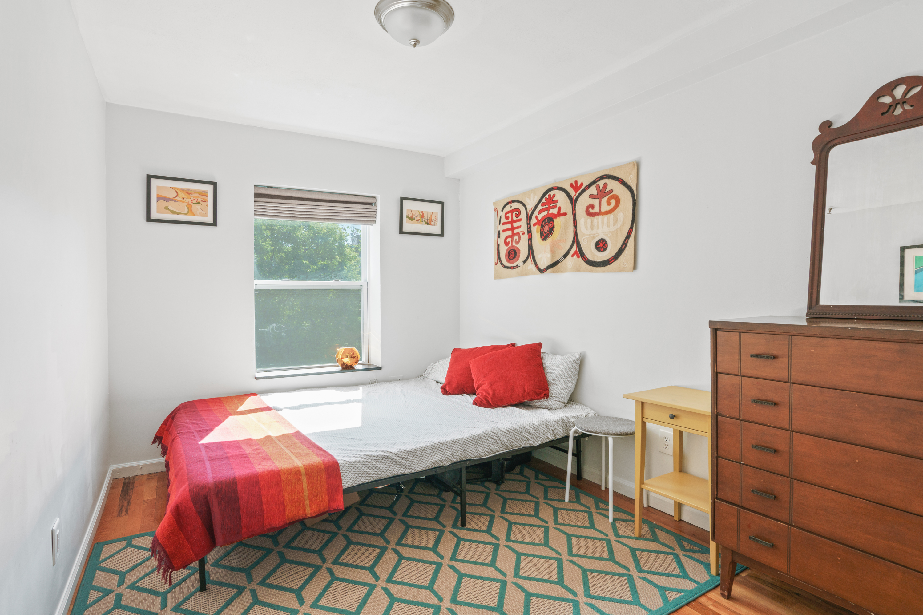 95 Vanderbilt Avenue, Unit AA Brooklyn, NY 11205 - Photo 7 of 11 a bedroom with a bed and a table in it