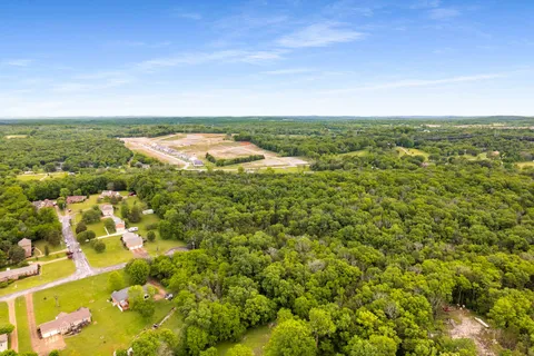 a view of a field with an ocean