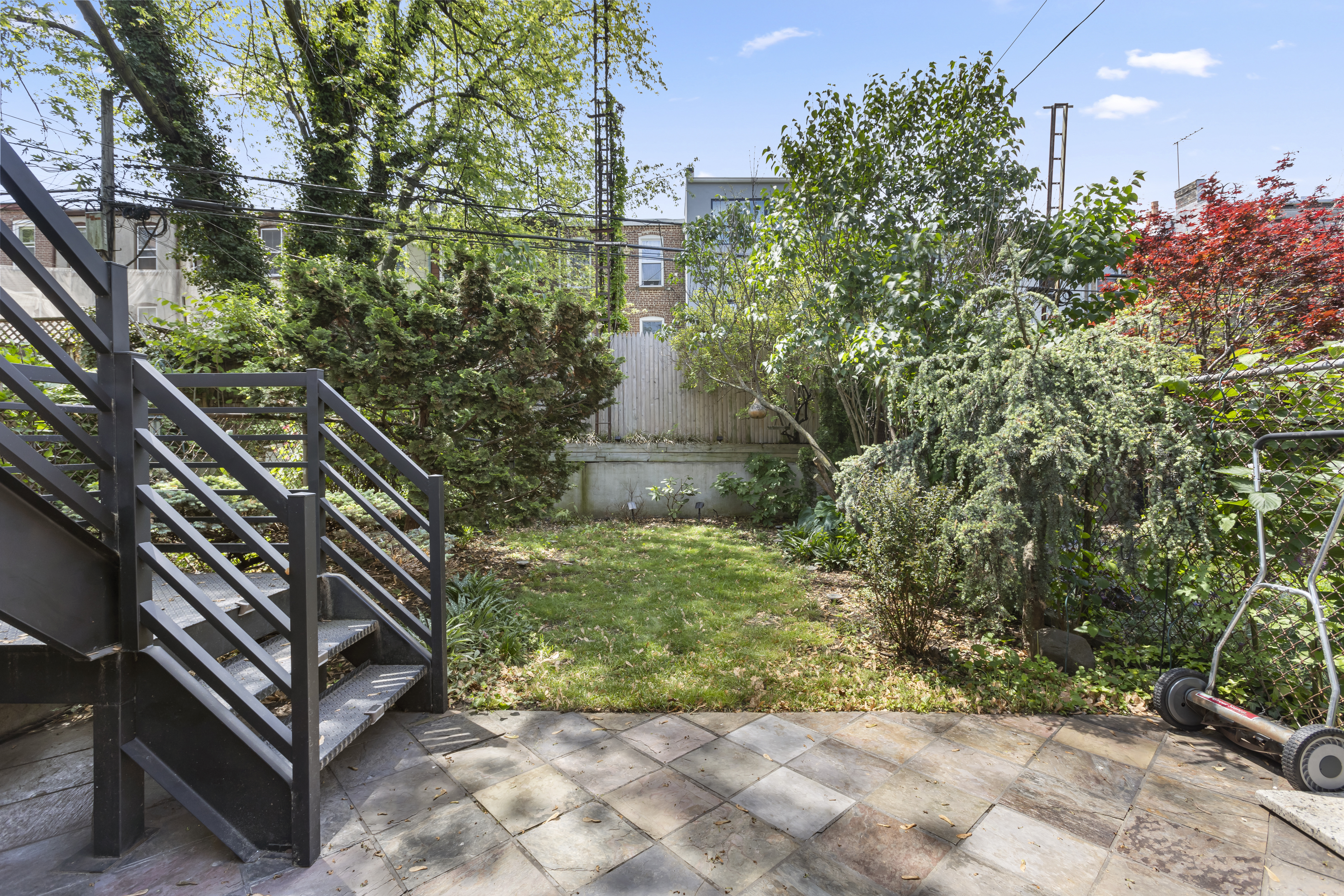 312 10th Street Brooklyn, NY 11215 - Photo 4 of 17 a view of a yard with plants and trees
