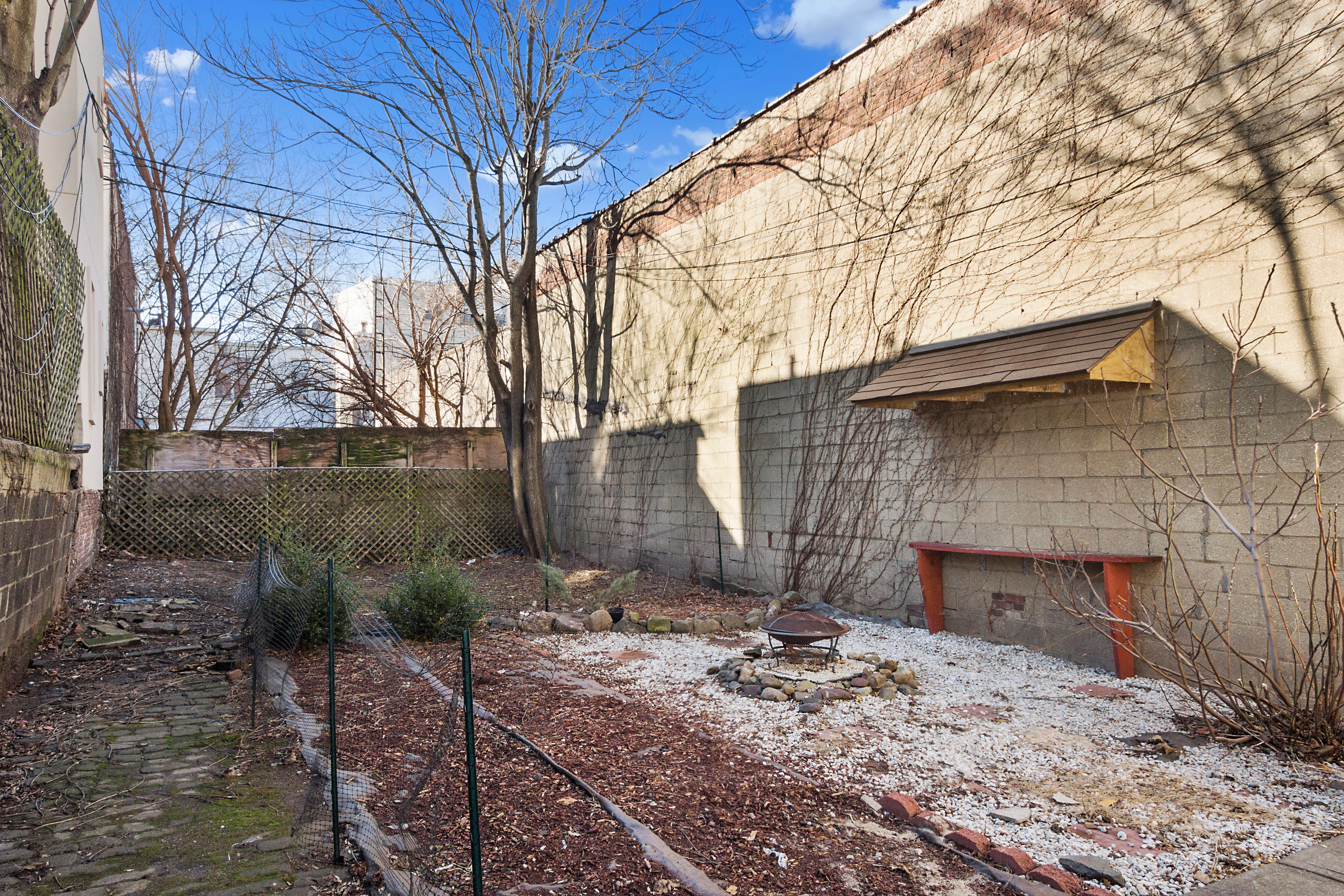 148 29th Street Brooklyn, NY 11232 - Photo 27 of 31 a backyard of a house with seating space