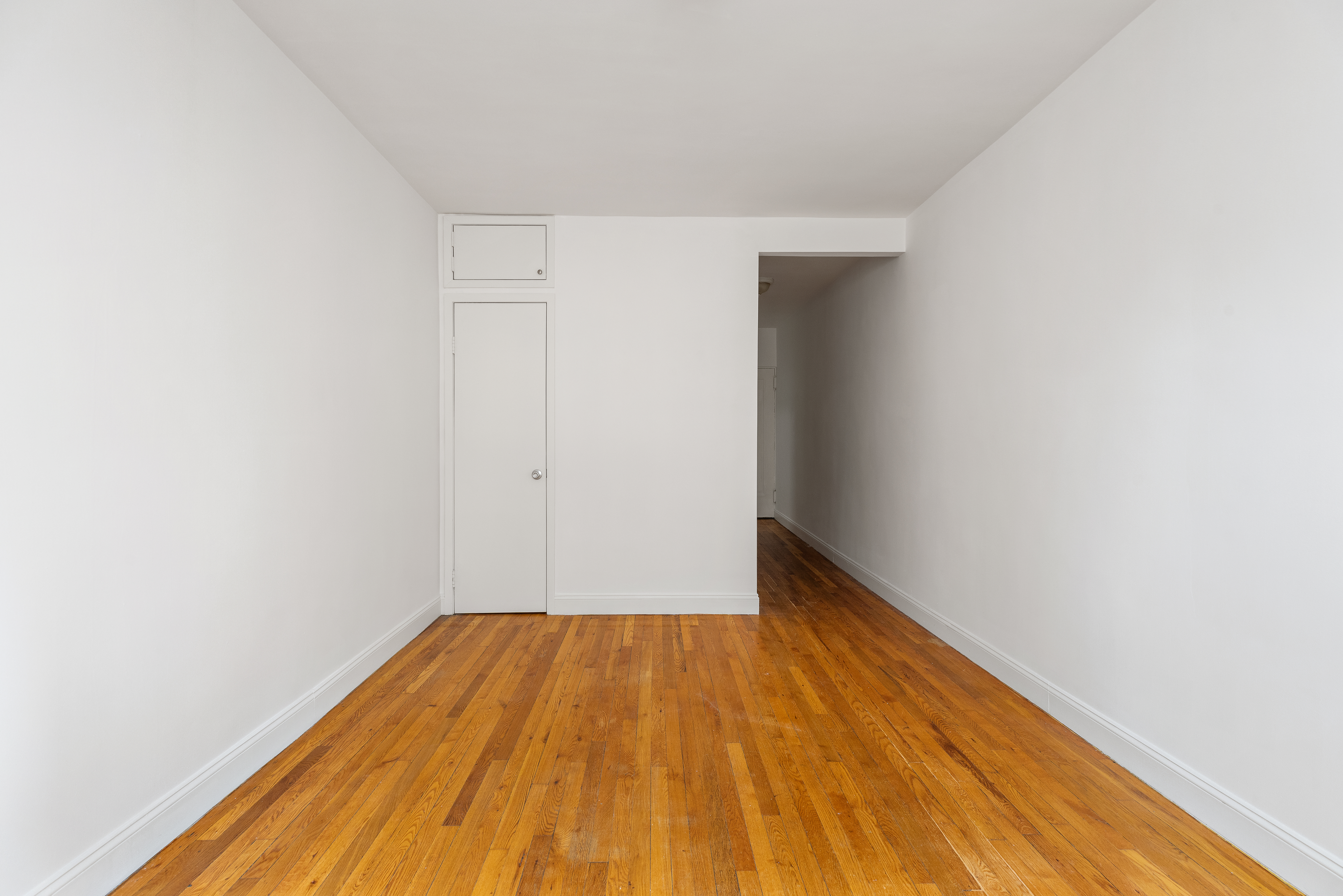 312 West 23rd Street, Unit 4G Manhattan, NY 10011 - Photo 8 of 12 a view of a room with wooden floor