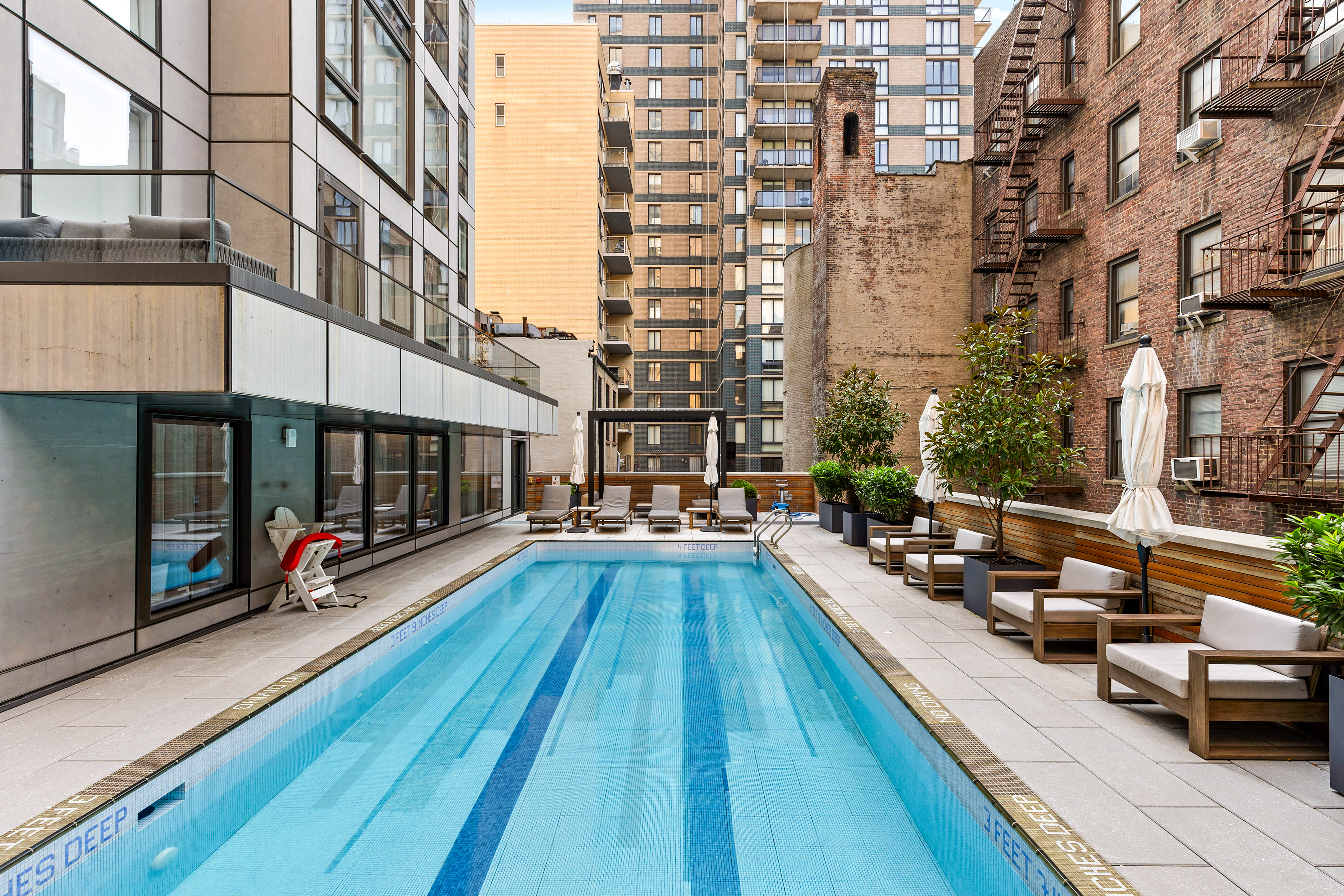 150 East 23rd Street, Unit 3C Manhattan, NY 10010 - Photo 9 of 12 a view of a swimming pool with outdoor seating