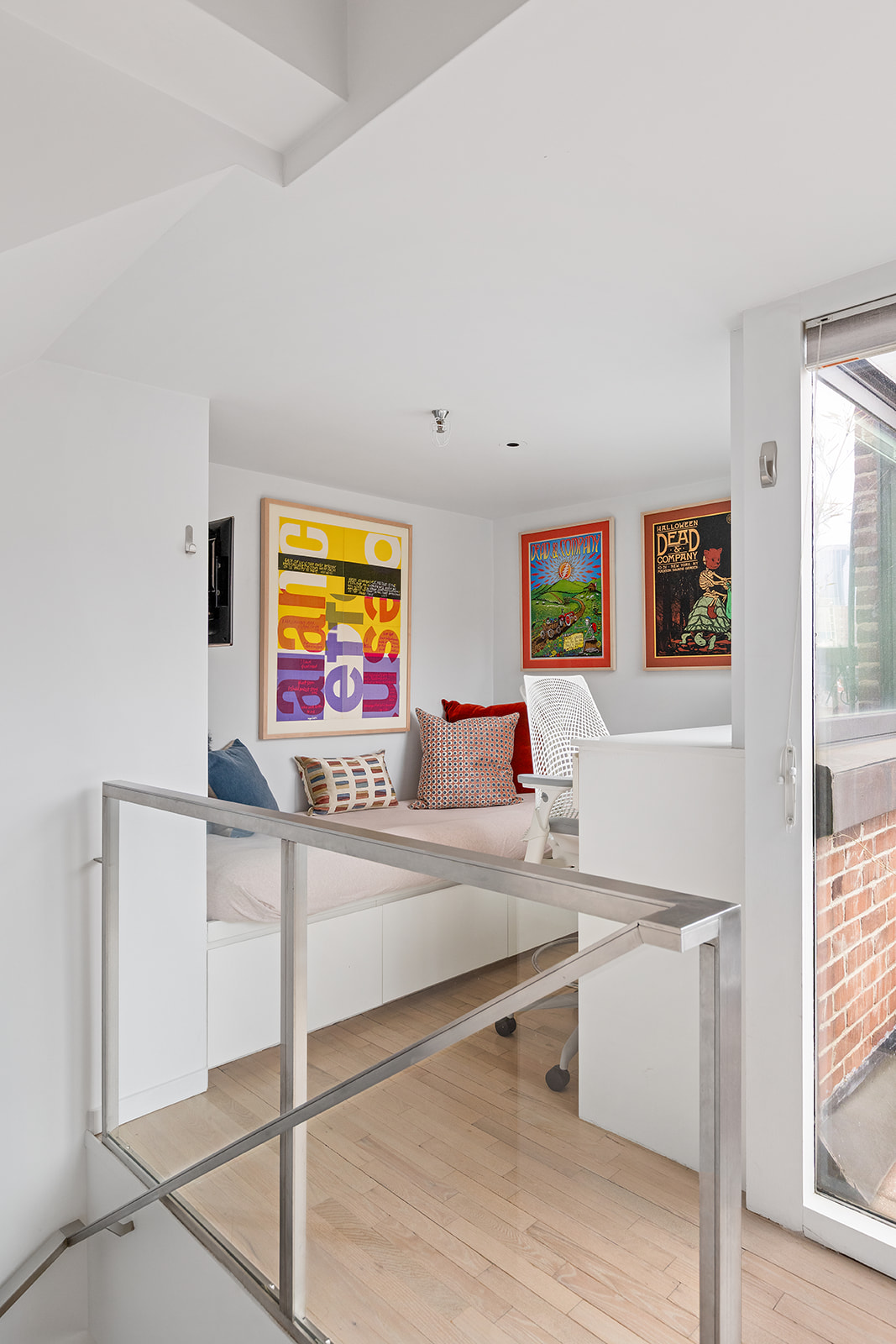 357 West 12th Street, Unit 5E Manhattan, NY 10014 - Photo 6 of 13 a bedroom with a bed and a flat screen tv