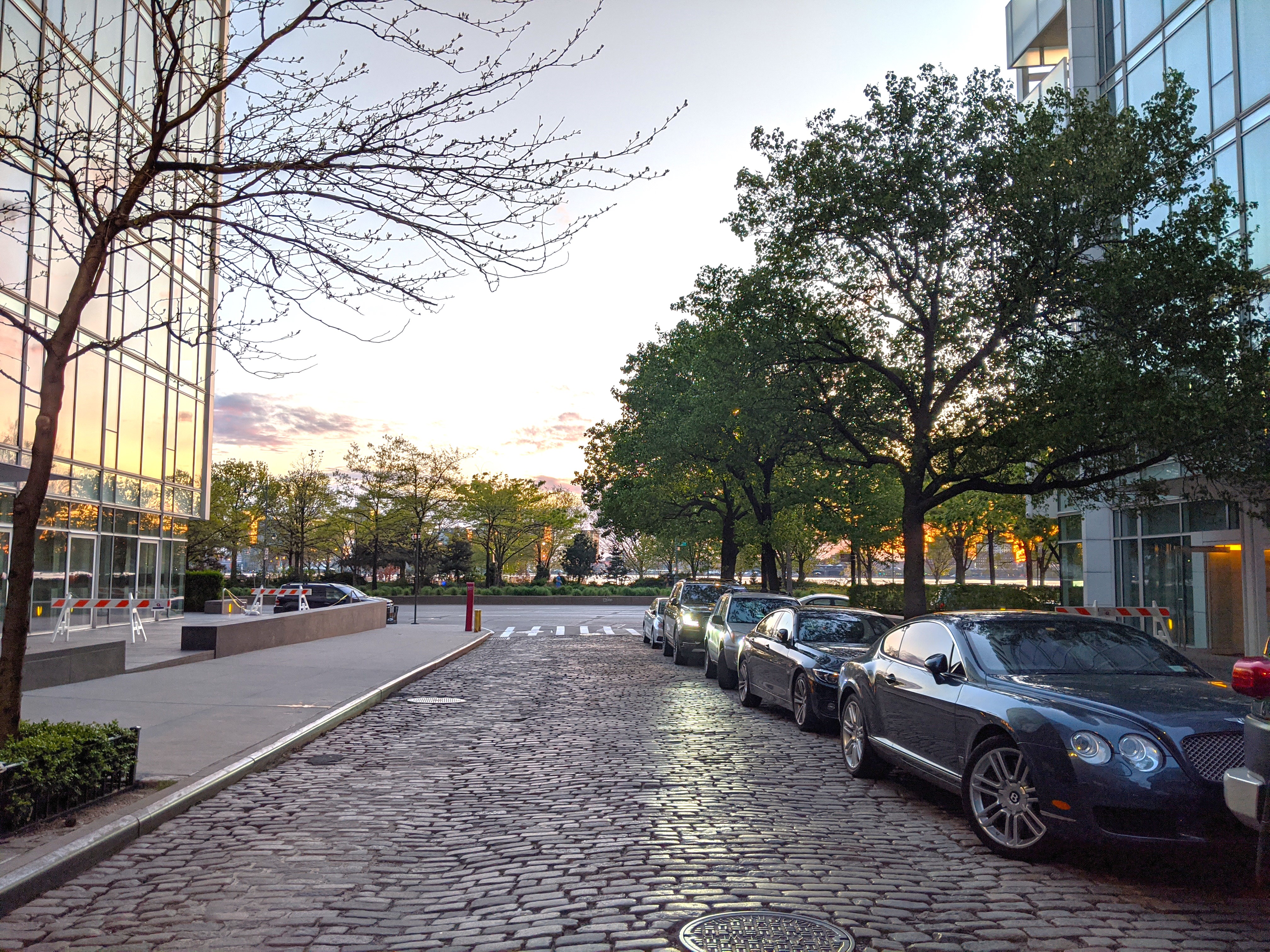 167 Perry Street, Unit 5D Manhattan, NY 10014 - Photo 13 of 18 a row of cars parked on the side of a street