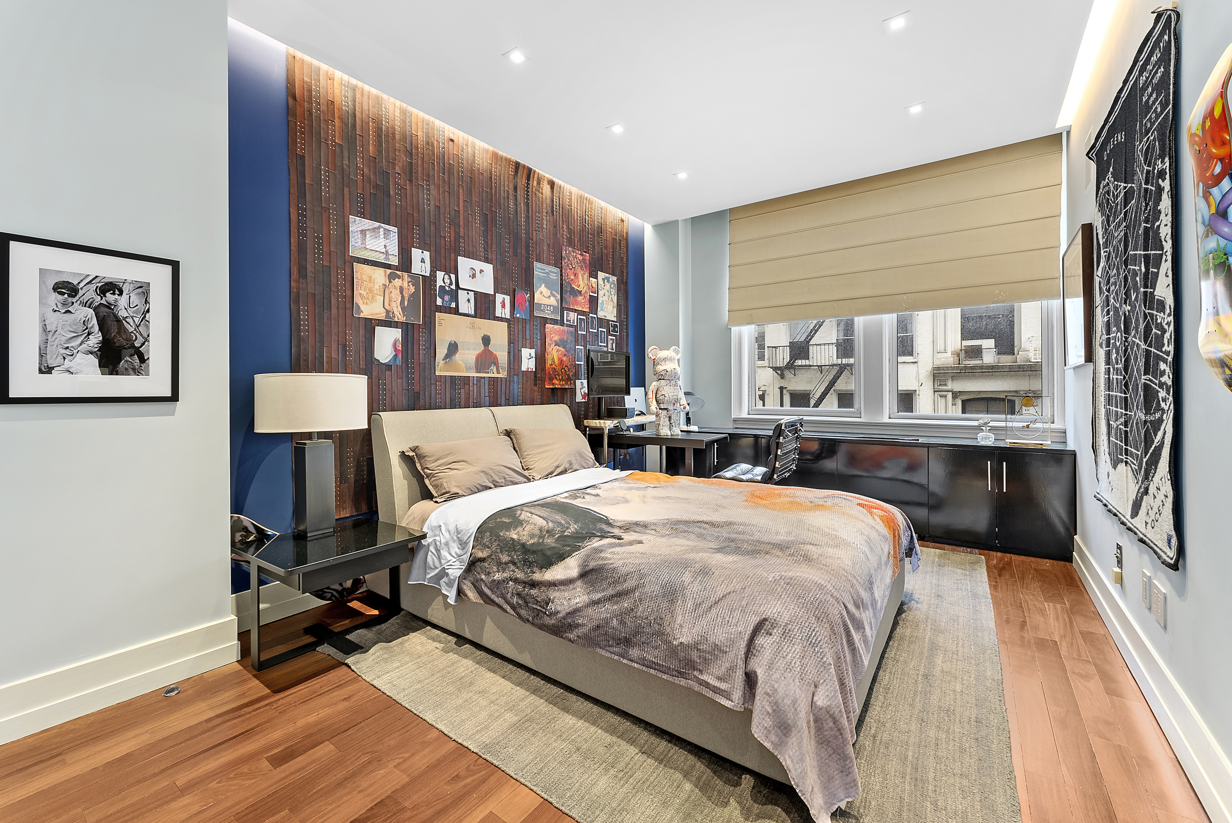 66 Leonard Street, Unit 2A Manhattan, NY 10013 - Photo 11 of 15 a bed room with a bed and a large window