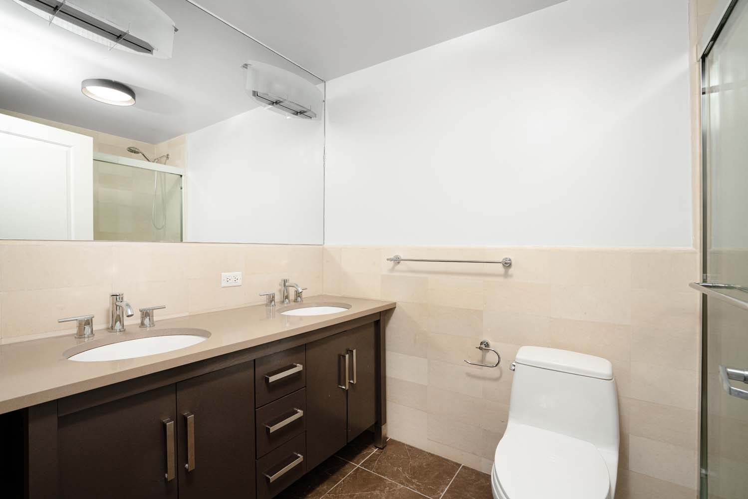 301 West 118th Street, Unit 8A Manhattan, NY 10026 - Photo 9 of 15 a bathroom with a toilet a sink and mirror