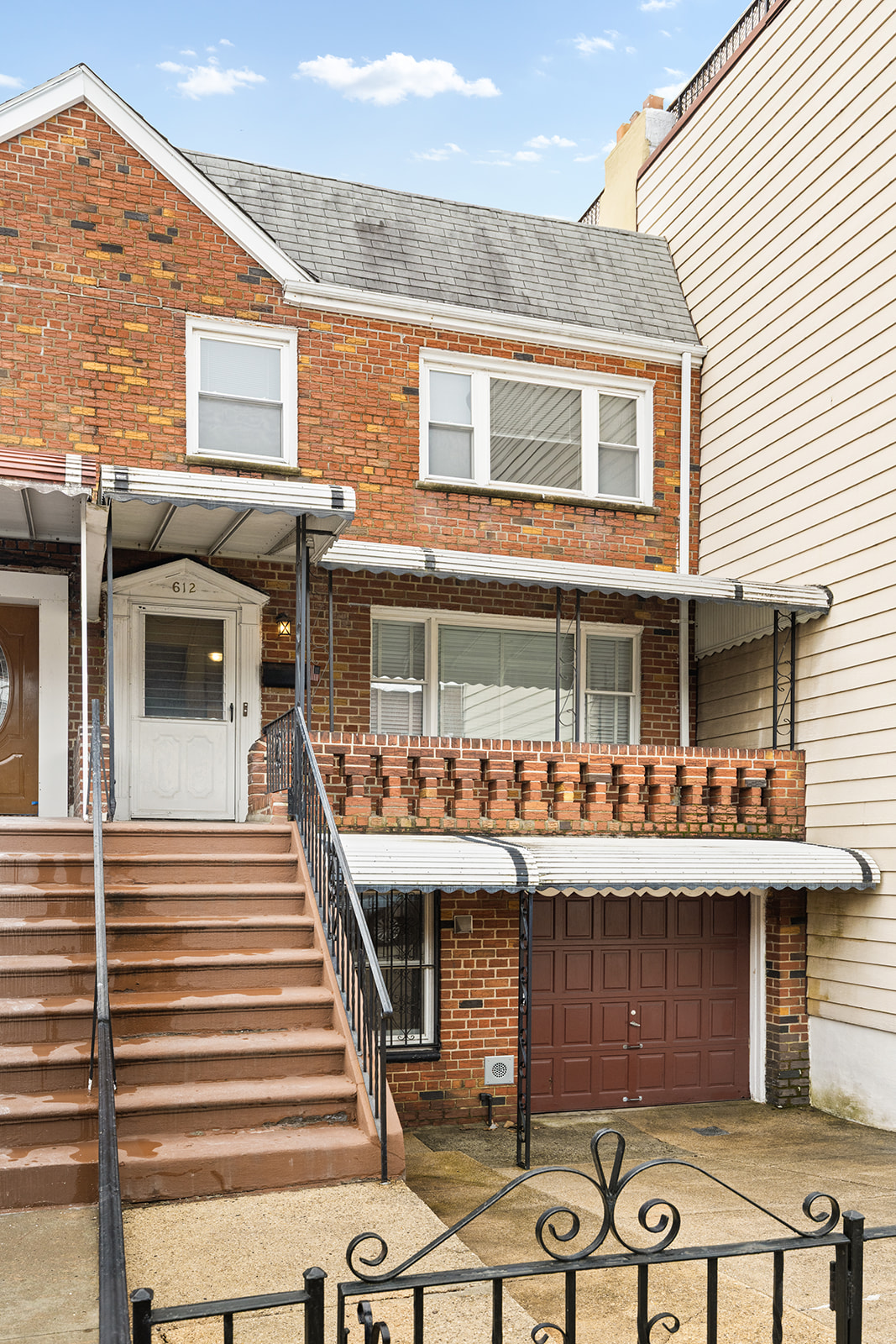 612 17th Street Brooklyn, NY 11218 - Photo 10 of 12 a front view of a house with garage