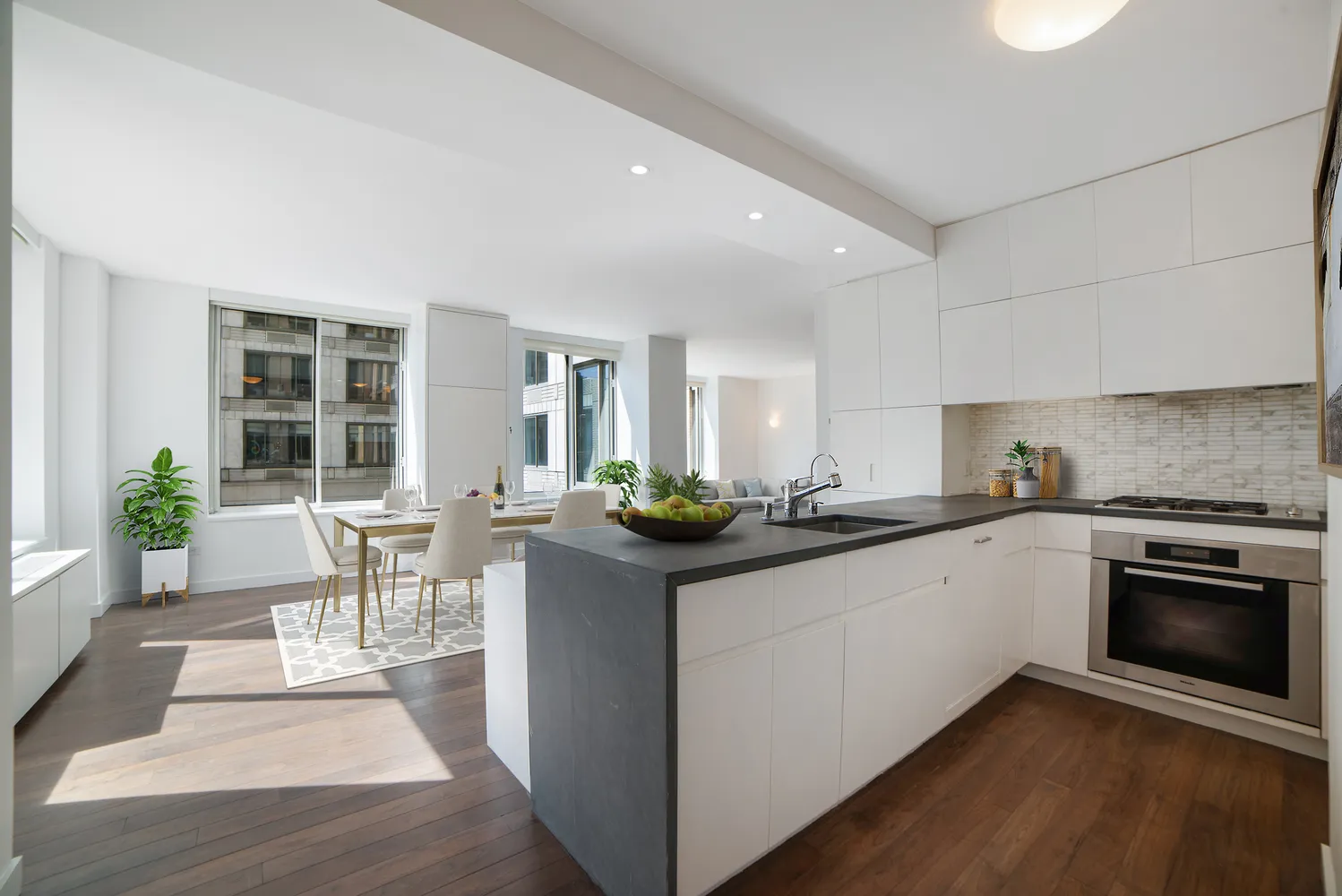 a kitchen with granite countertop a sink and a stove top oven