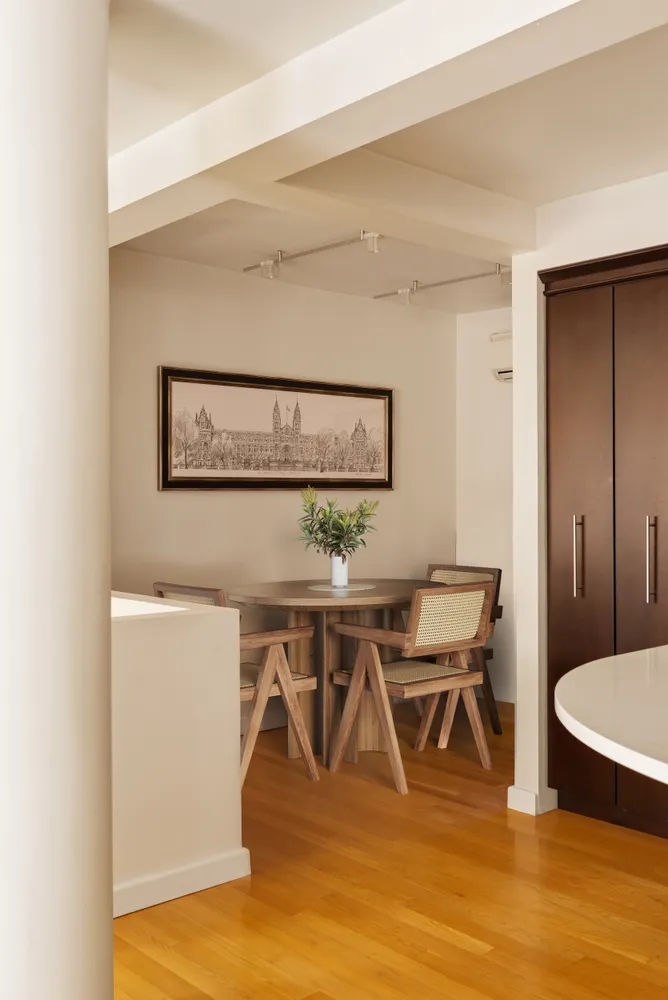 a view of a dining room with furniture and wooden floor