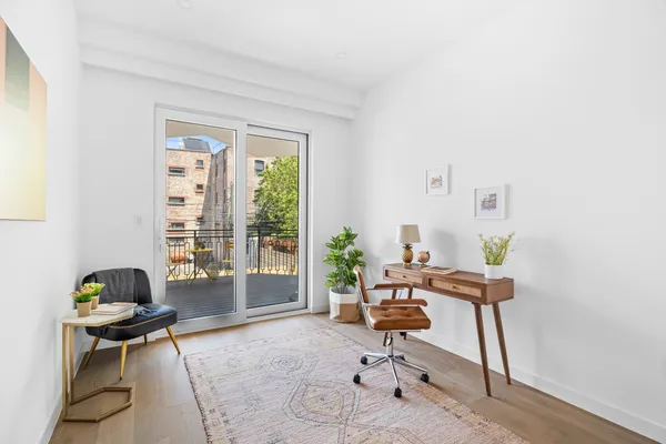 a workspace with furniture and a window