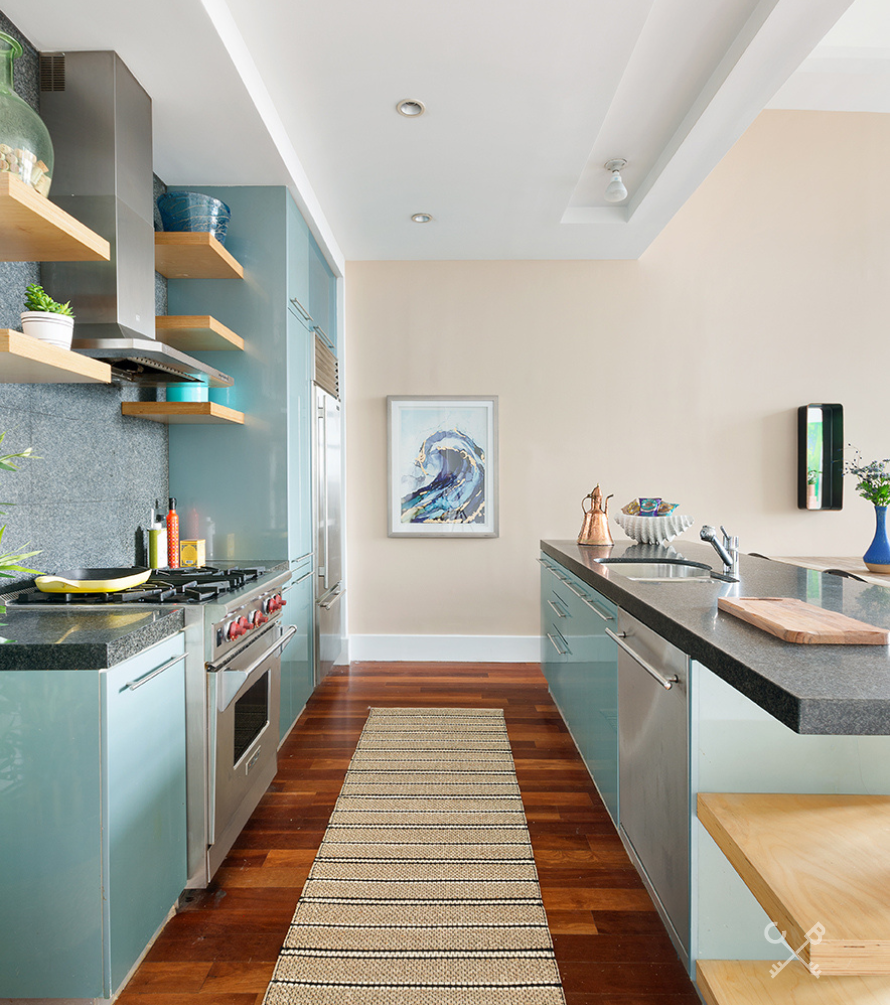 60 Broadway, Unit 10M Brooklyn, NY 11249 - Photo 7 of 12 a kitchen with stainless steel appliances granite countertop lots of counter top space