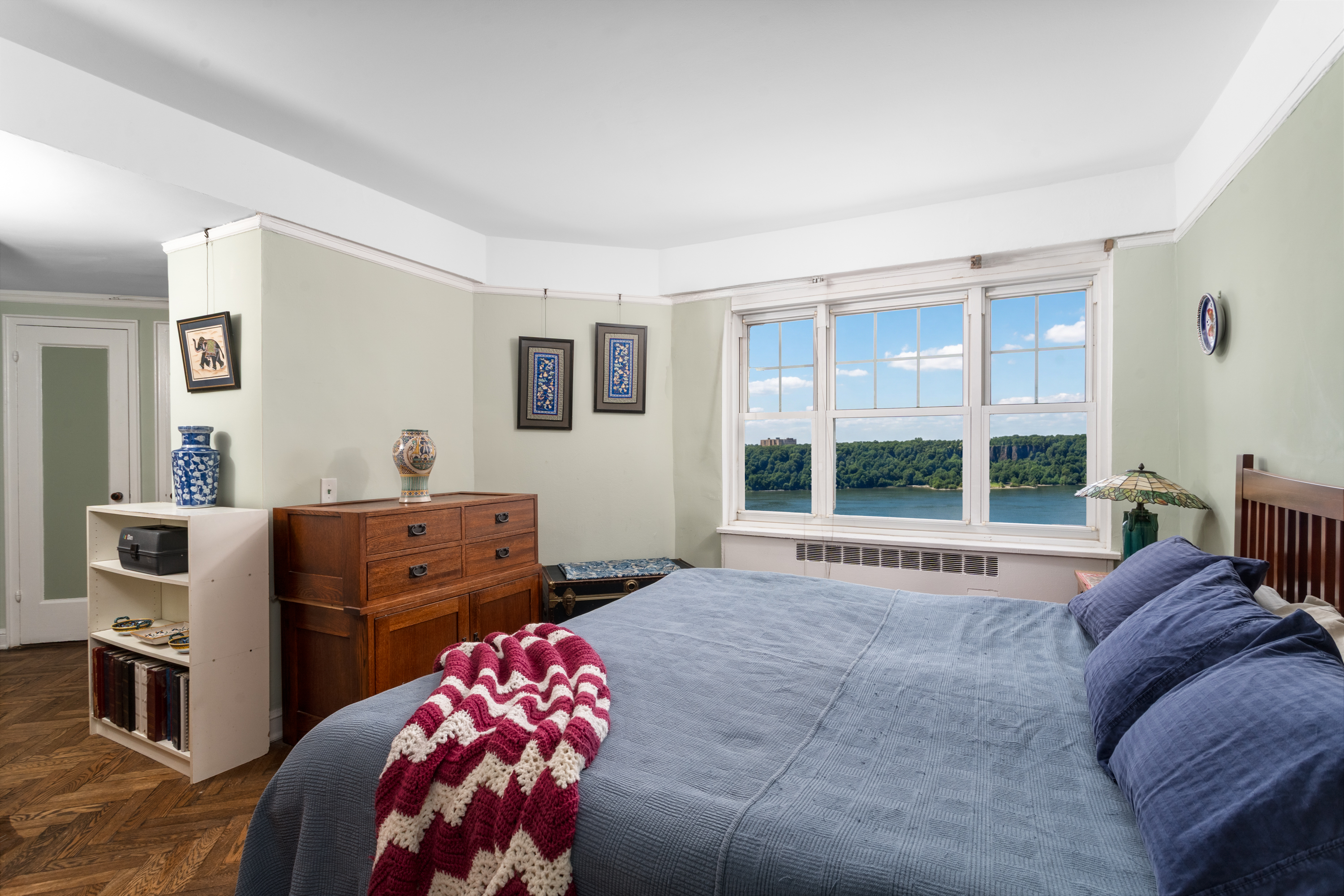 180 Cabrini Boulevard, Unit 61 Manhattan, NY 10033 - Photo 13 of 33 a bed room with a bed and a dresser