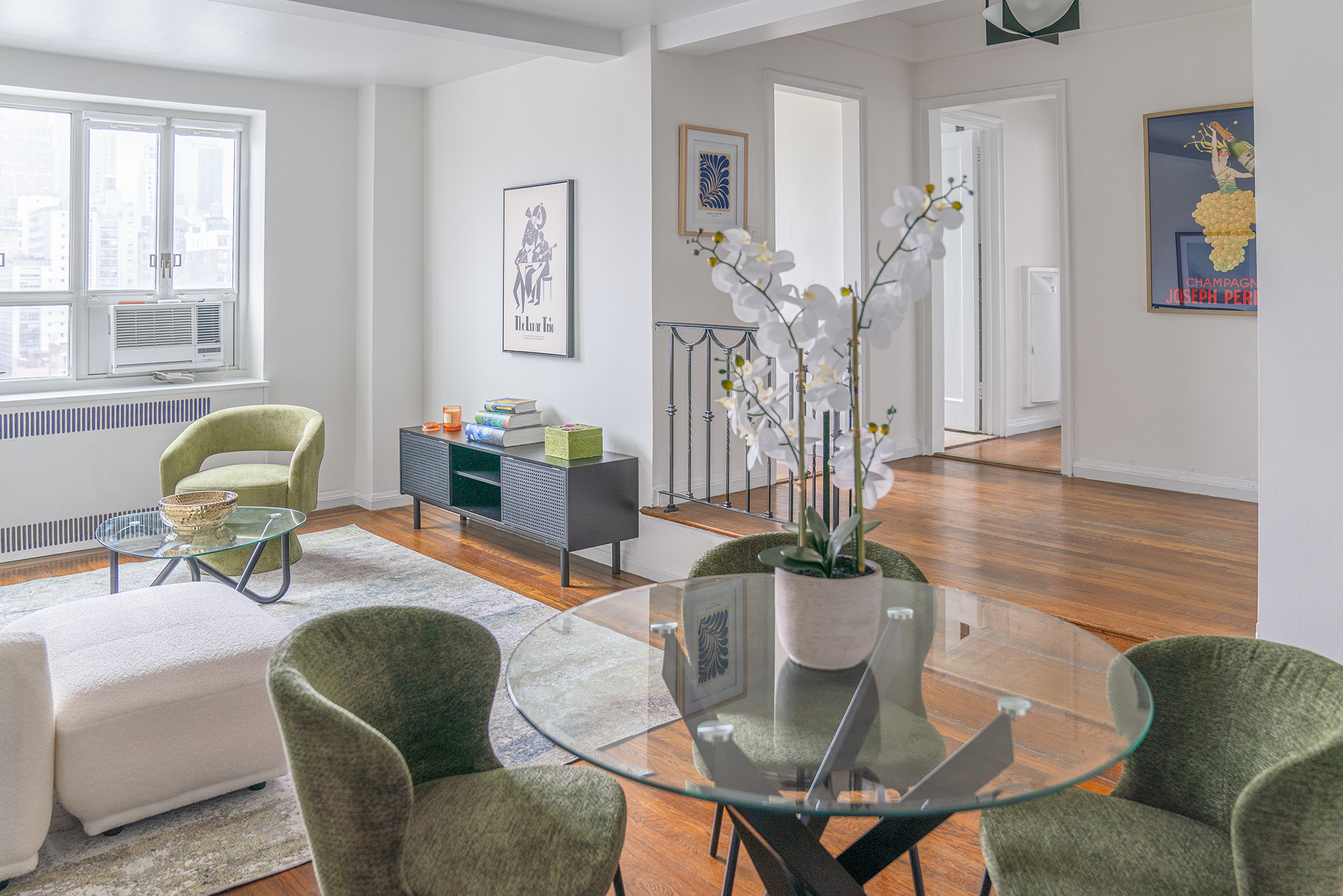 200 West 20th Street, Unit 1208 Manhattan, NY 10011 - Photo 6 of 14 a living room with furniture and wooden floor