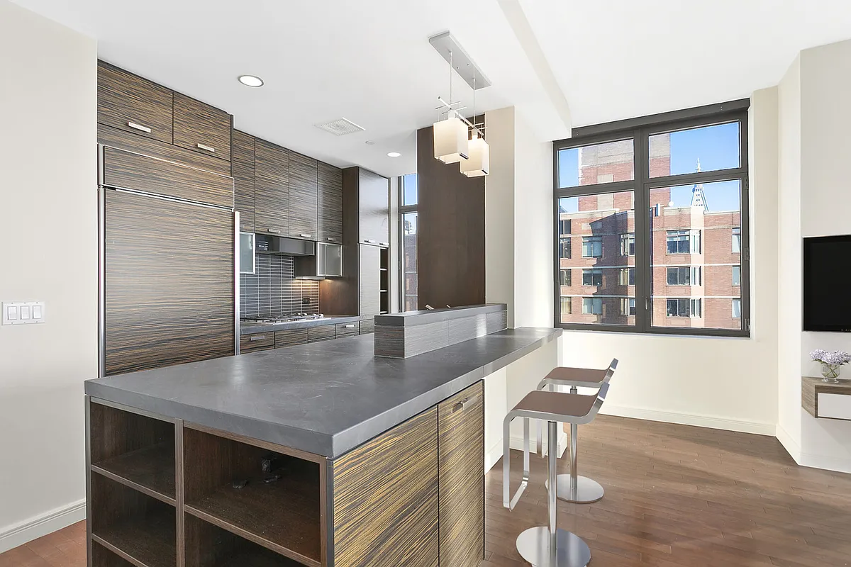 101 West 24th Street, Unit 26D Manhattan, NY 10011 - Photo 3 of 18 a kitchen with a table chairs and entryway