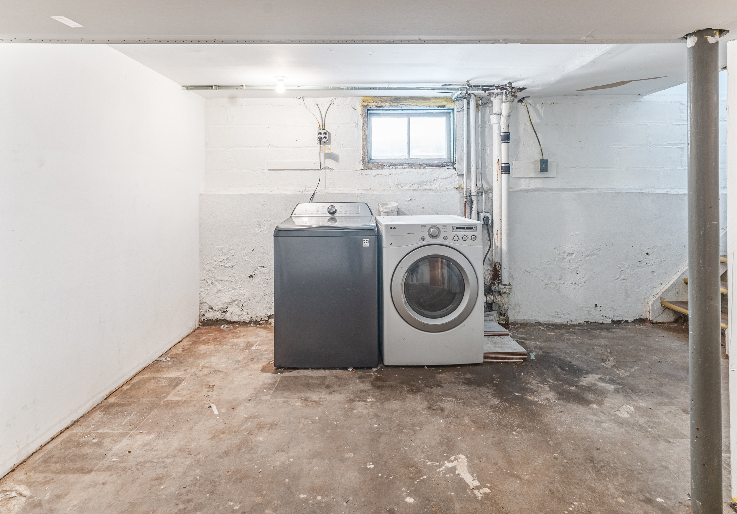 69-29 67th Place Queens, NY 11385 - Photo 24 of 24 a utility room with dryer and washer
