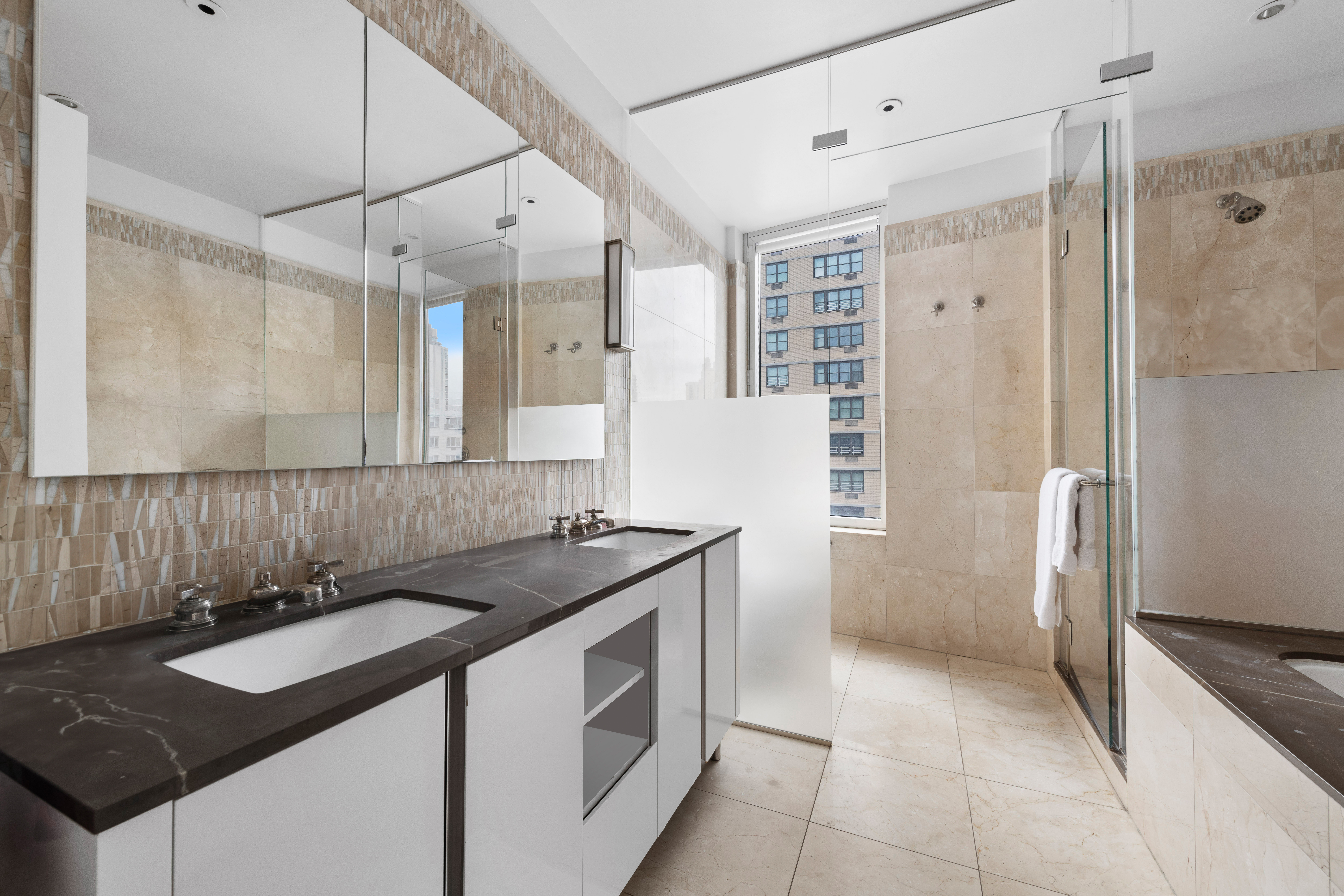 255 East 74th Street, Unit 14C Manhattan, NY 10021 - Photo 10 of 14 a kitchen with a sink stove and refrigerator