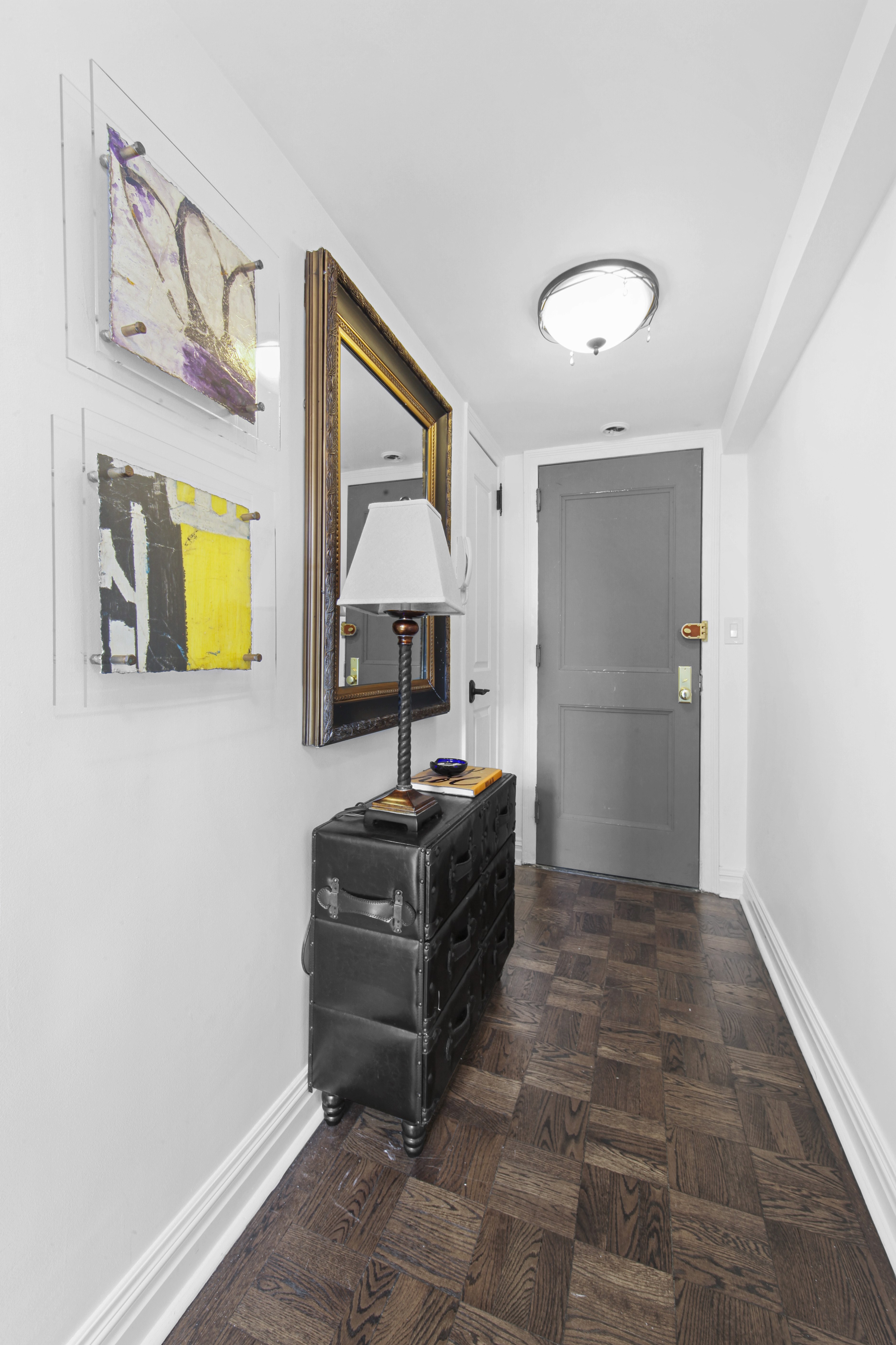 320 East 42nd Street, Unit 3012 Manhattan, NY 10017 - Photo 11 of 12 a living room with furniture and a painting on the wall