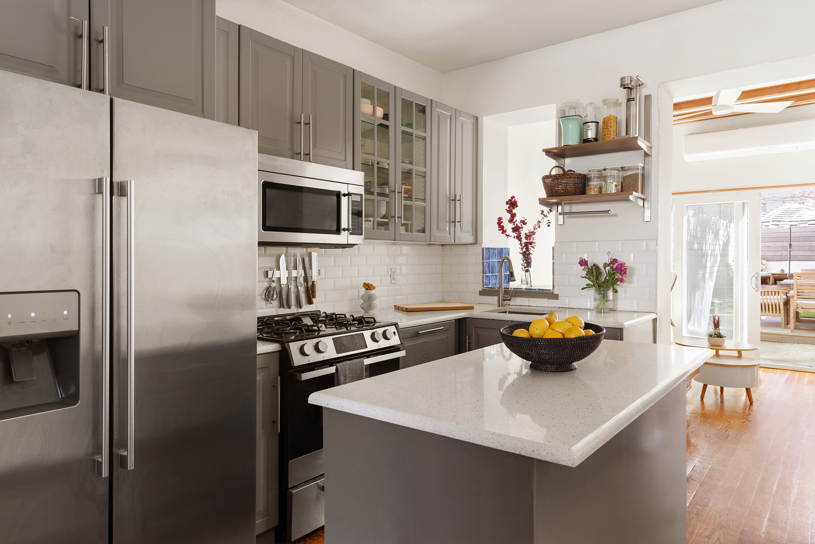 171 Monitor Street Brooklyn, NY 11222 - Photo 4 of 11 a kitchen with stainless steel appliances a sink a stove a refrigerator and cabinets