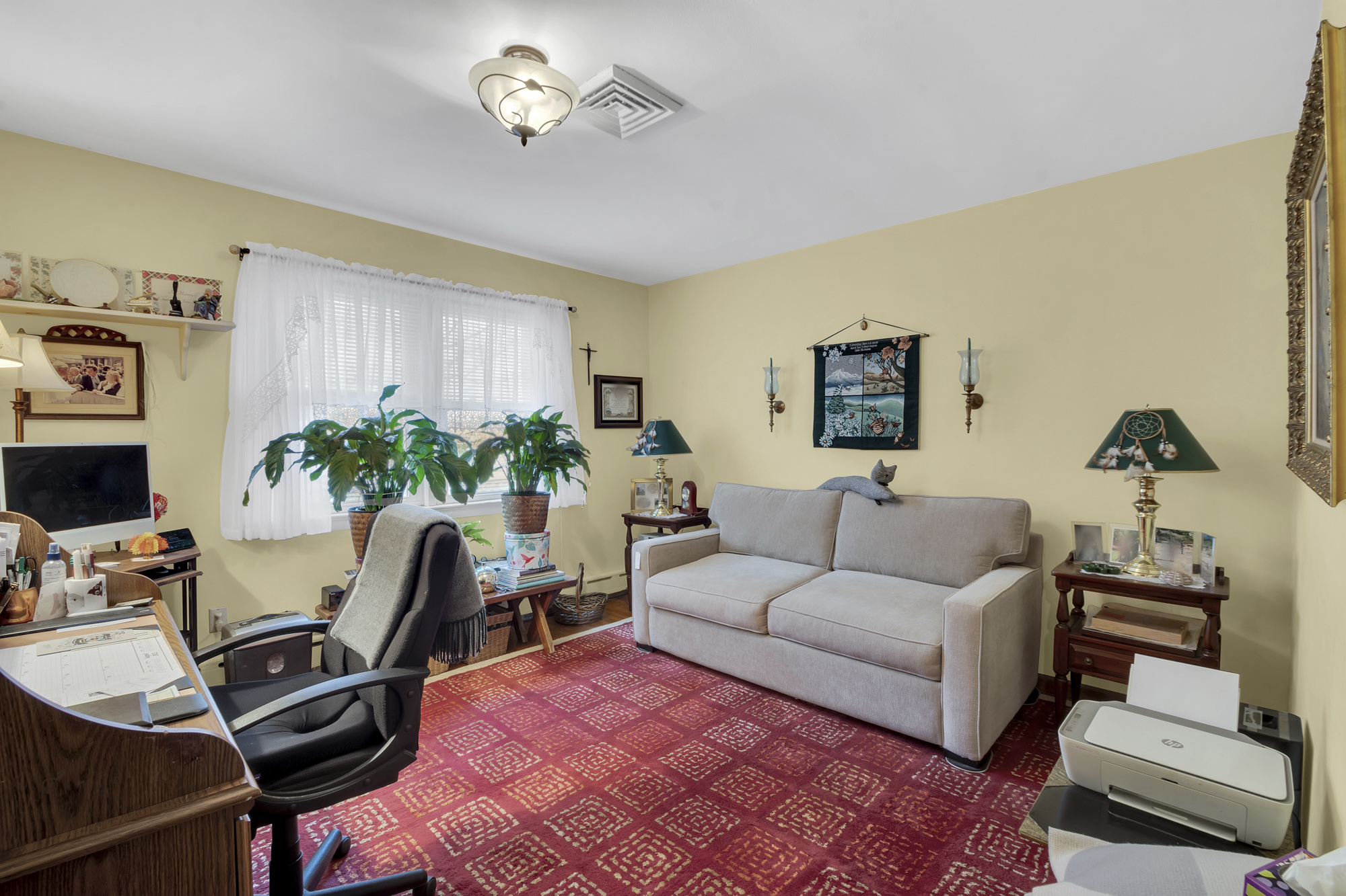 131 Jansen Street Staten Island, NY 10312 - Photo 9 of 21 a living room with furniture a chandelier and a window