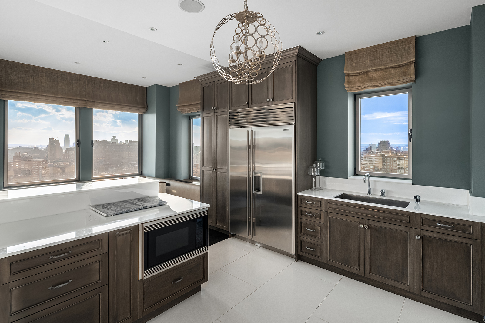 252 7th Avenue, Unit PHD Manhattan, NY 10001 - Photo 21 of 26 a kitchen with a sink and stove