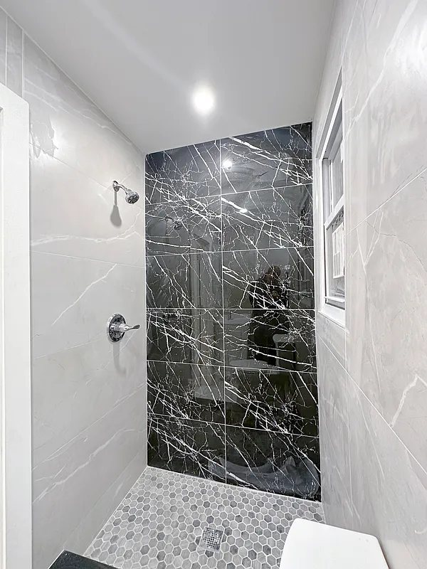 55 Spring Street, Unit 7 Manhattan, NY 10012 - Photo 11 of 12 a bathroom with a shower