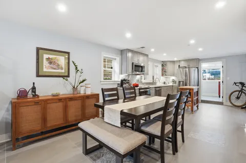 a view of a dining room with furniture and a livingroom