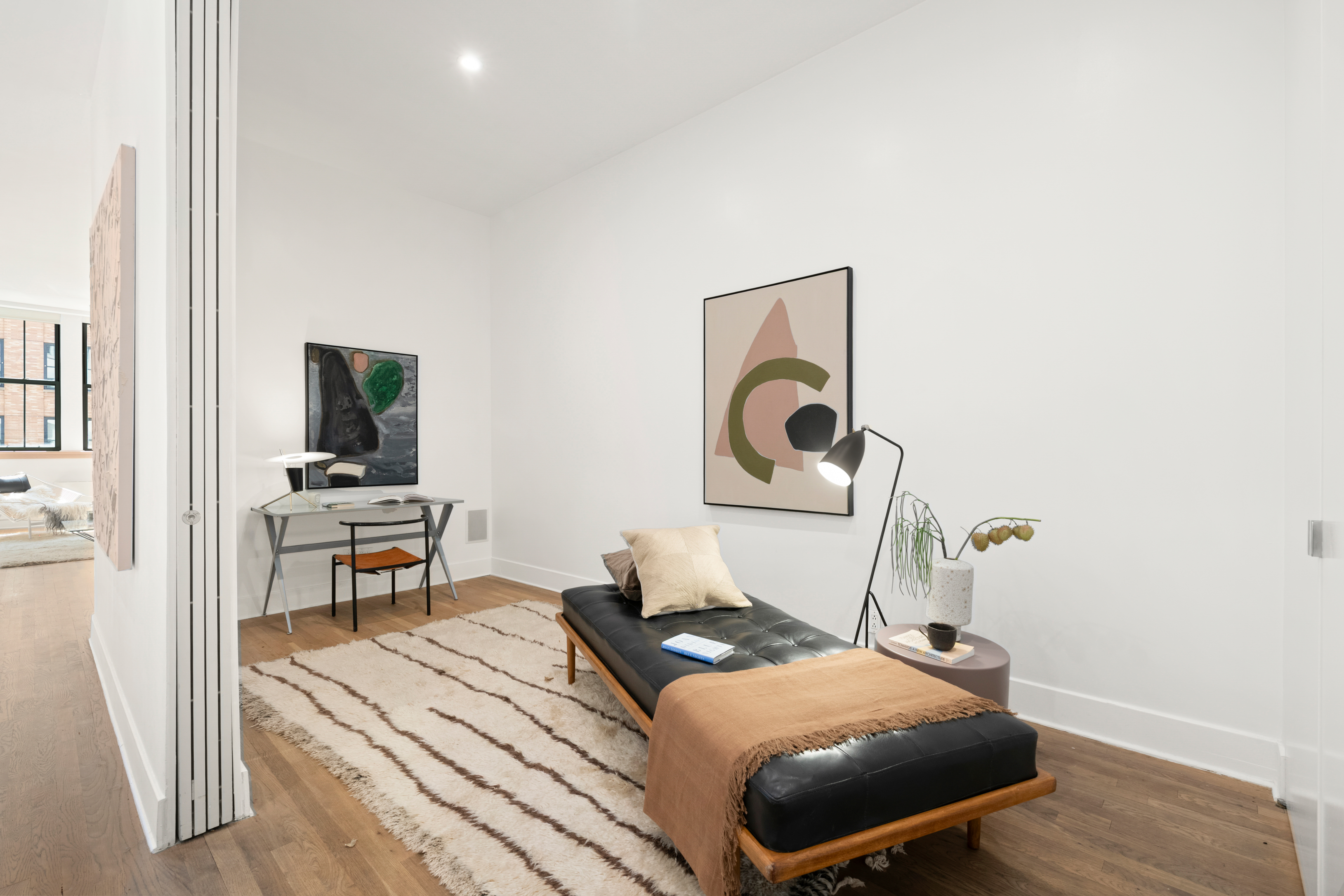 53 North Moore Street, Unit 2F East Manhattan, NY 10013 - Photo 9 of 12 a bedroom with a bed and wooden floor