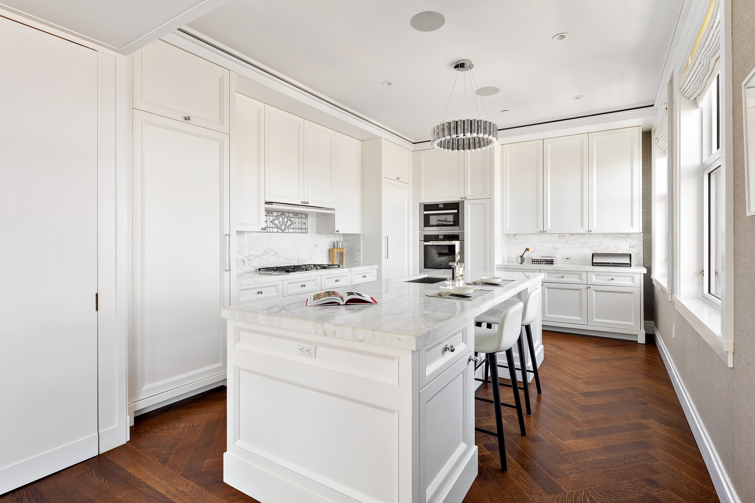 2 Park Place, Unit 35A Manhattan, NY 10007 - Photo 6 of 21 a kitchen with white cabinets and white appliances