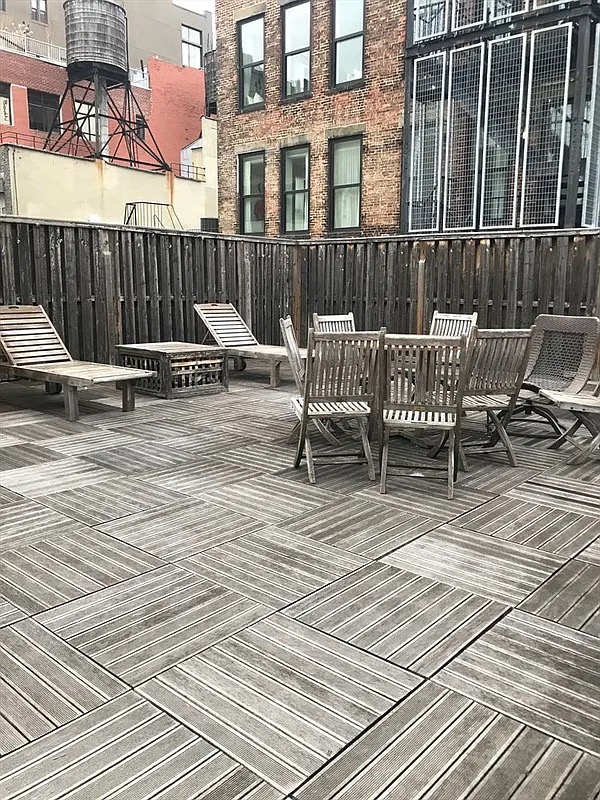 43 East 10th Street, Unit 5J Manhattan, NY 10003 - Photo 6 of 7 a view of a wooden deck with a bench