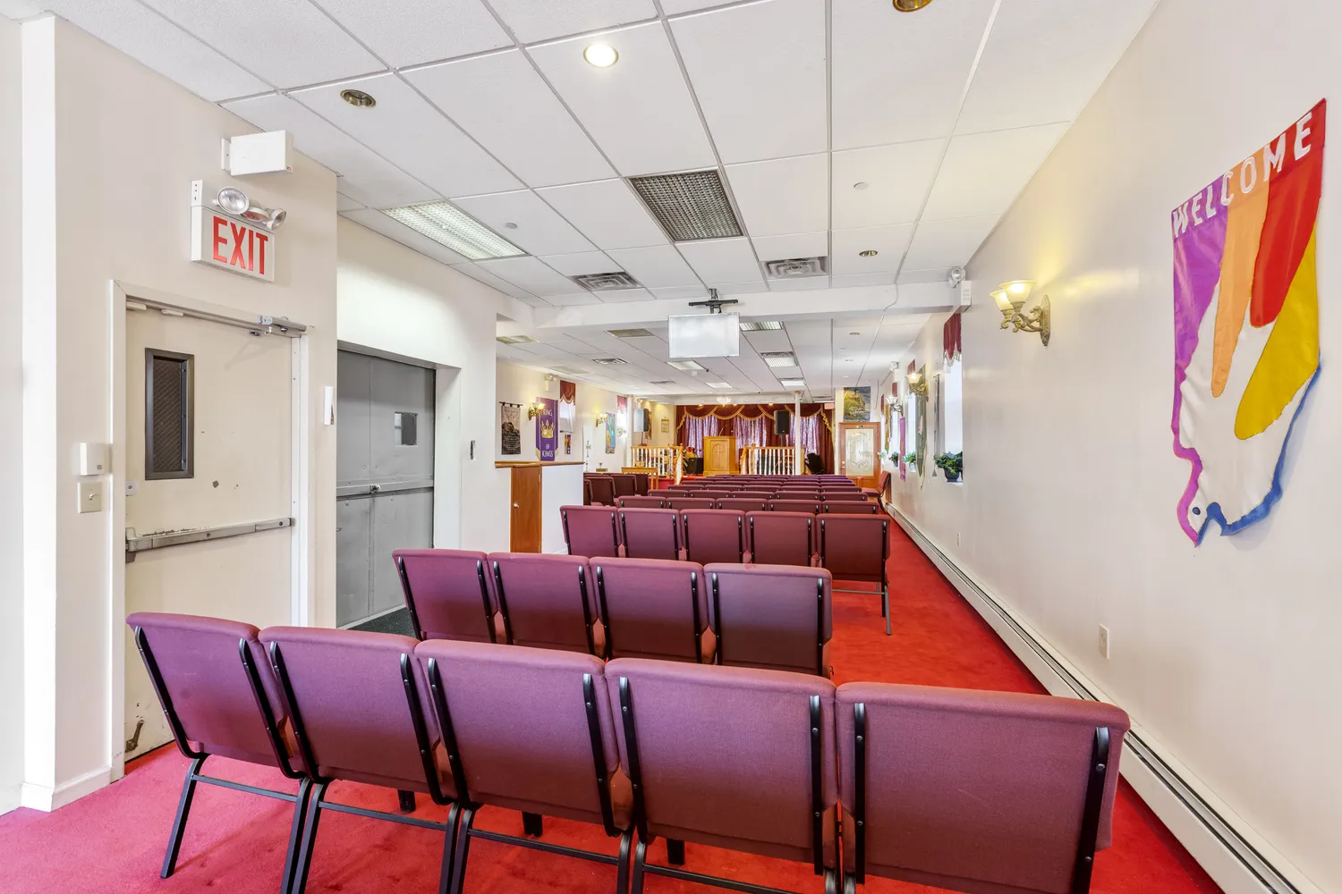 a living room with furniture a ceiling fan and a rug