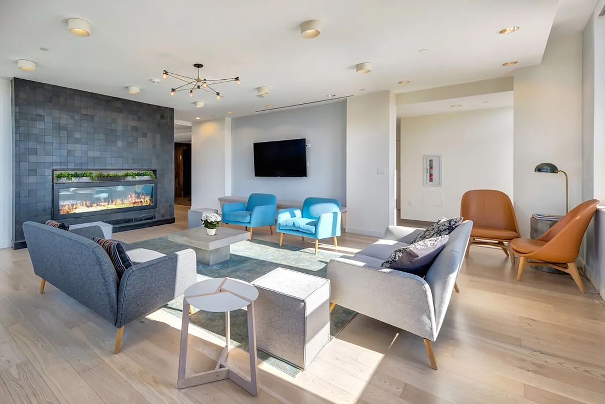 626 Flatbush Avenue, Unit 7E Brooklyn, NY 11225 - Photo 9 of 23 a living room with furniture and a flat screen tv