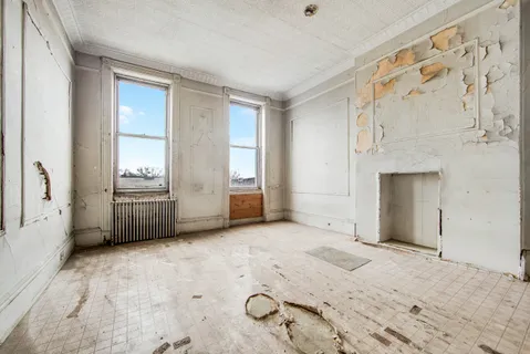 a view of an empty room with a window