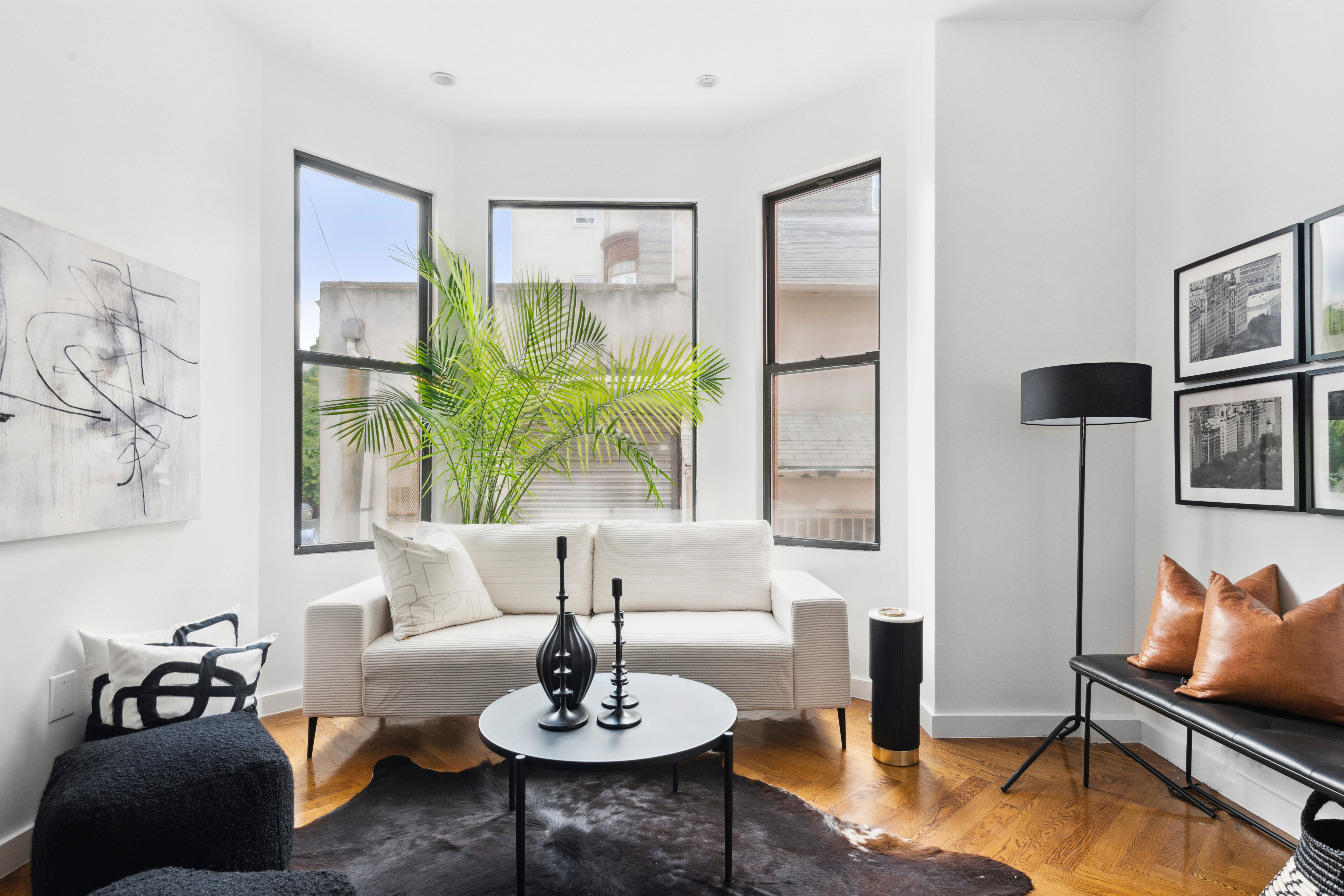 875 Saint Marks Avenue, Unit 1B Brooklyn, NY 11213 - Photo 3 of 9 a living room with furniture and wooden floor
