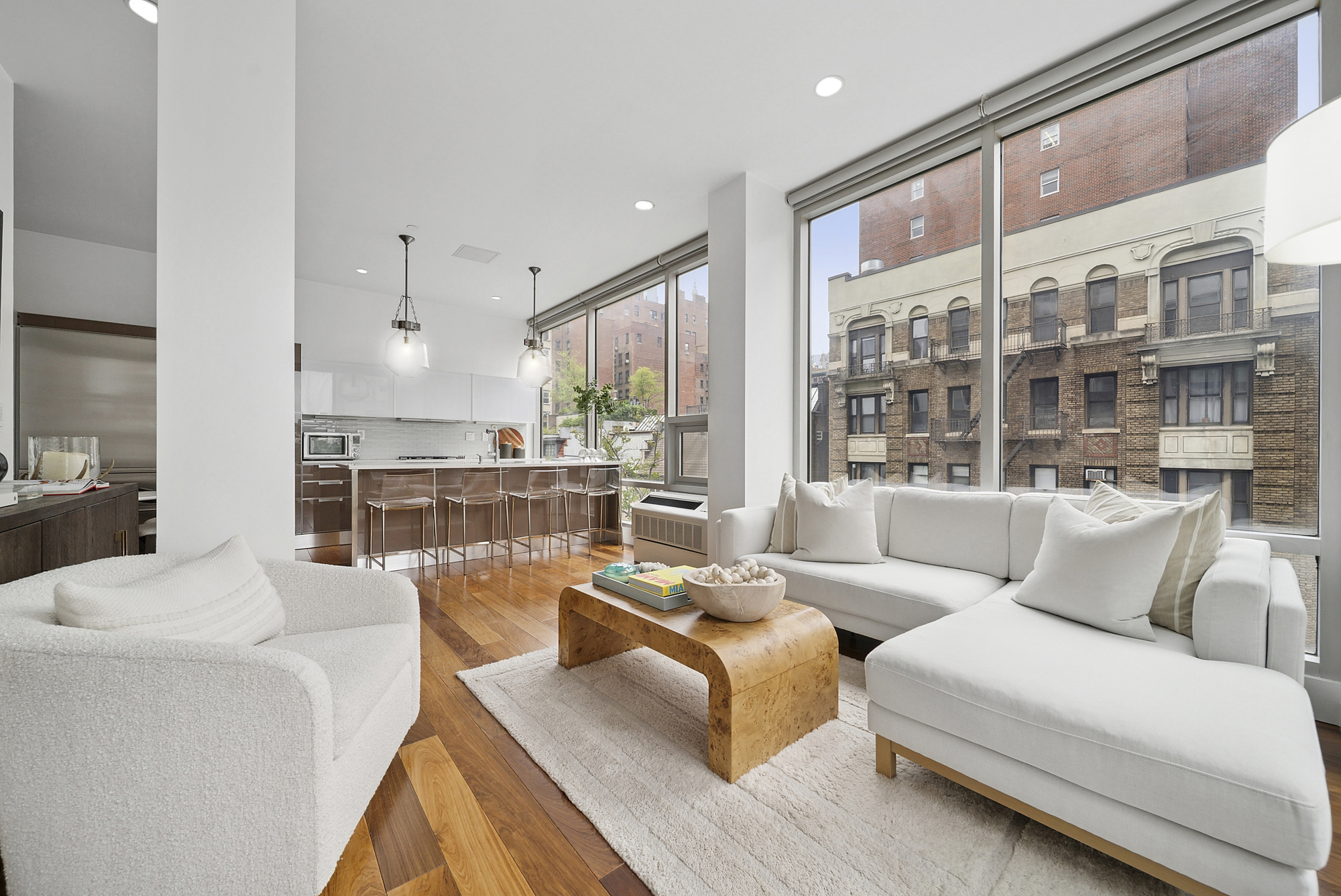148 East 19th Street, Unit 4B Manhattan, NY 10003 - Photo 3 of 10 a living room with furniture and a large window