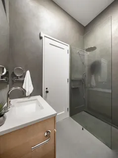 a bathroom with a sink and shower