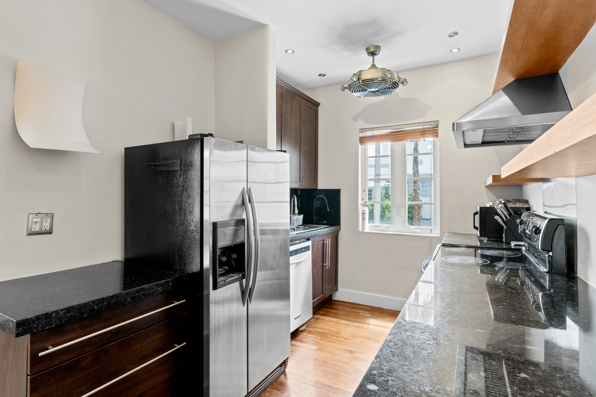 711 East 14th Street, Unit 7 Hialeah, FL 33010 - Photo 16 of 36 a kitchen with a refrigerator and a stove