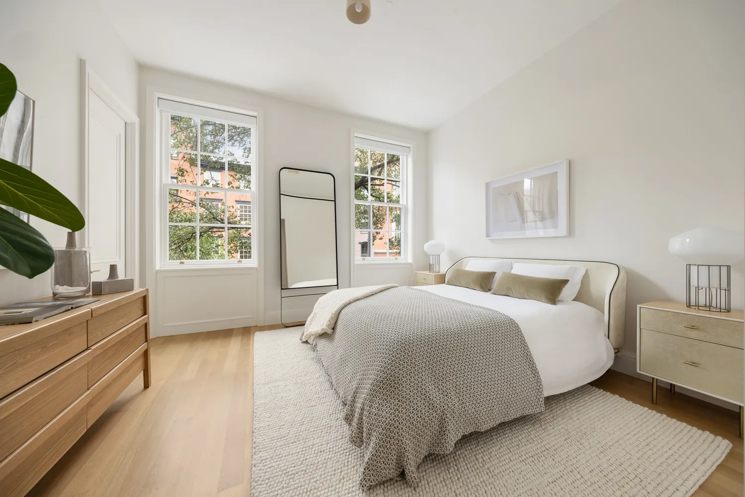 a spacious bedroom with a bed and a window