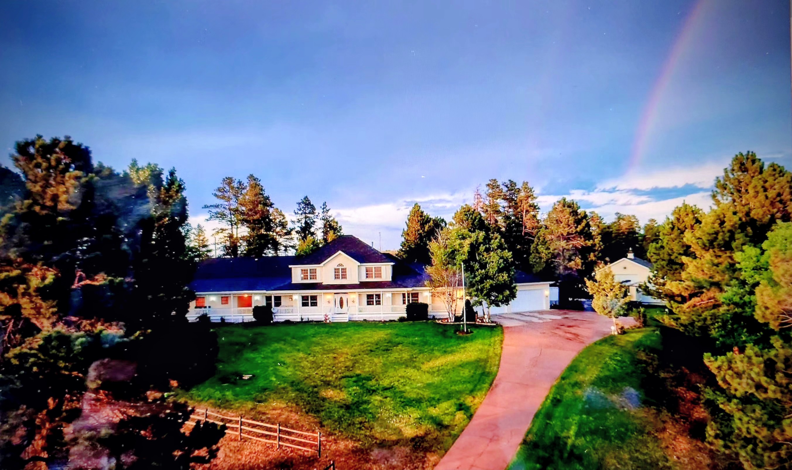 7550 North Village Road Parker, CO 80134 - Photo 8 of 13 a view of a house with a big yard