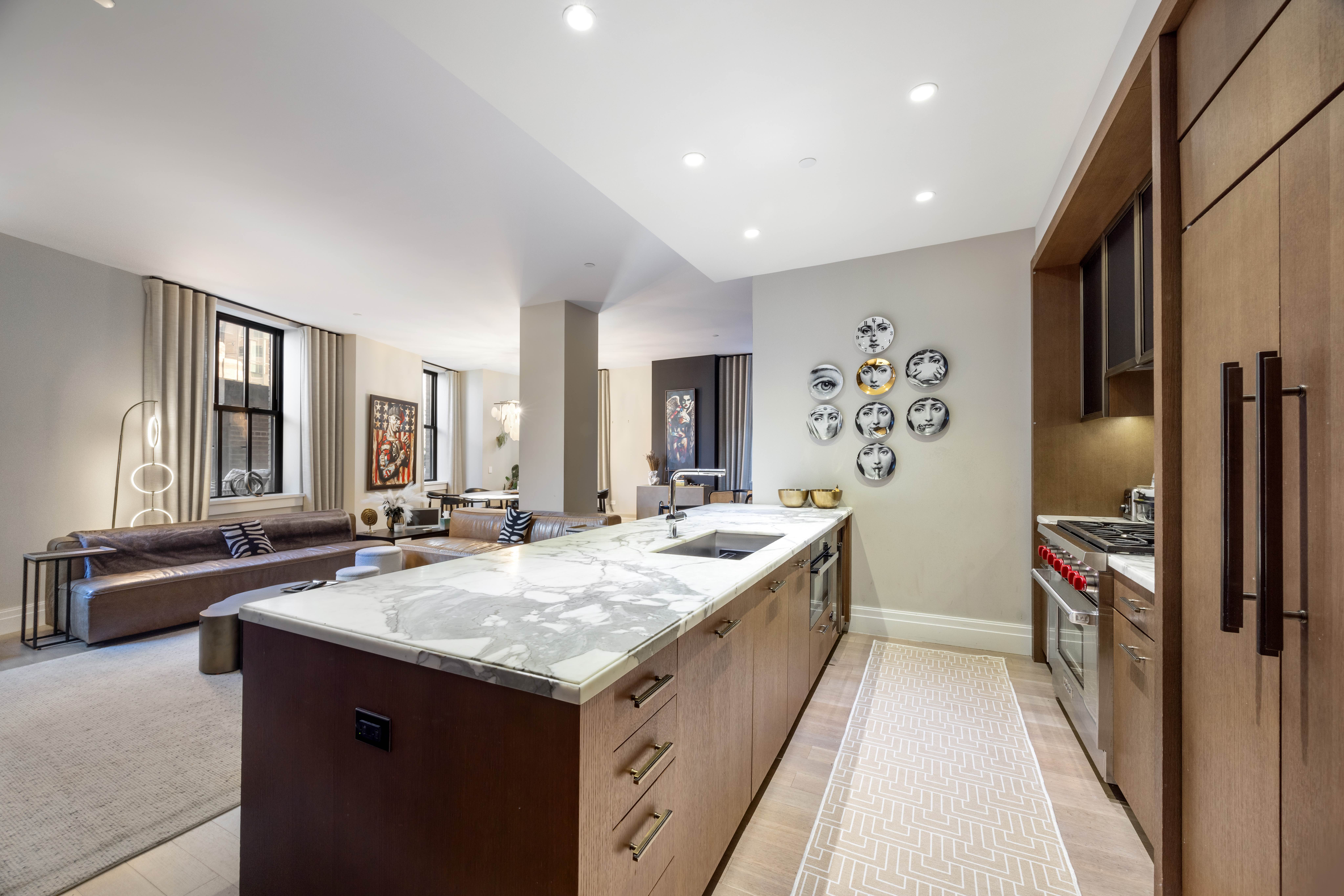 100 Barclay Street, Unit 16G Manhattan, NY 10007 - Photo 8 of 28 a large kitchen with kitchen island a sink stove and refrigerator
