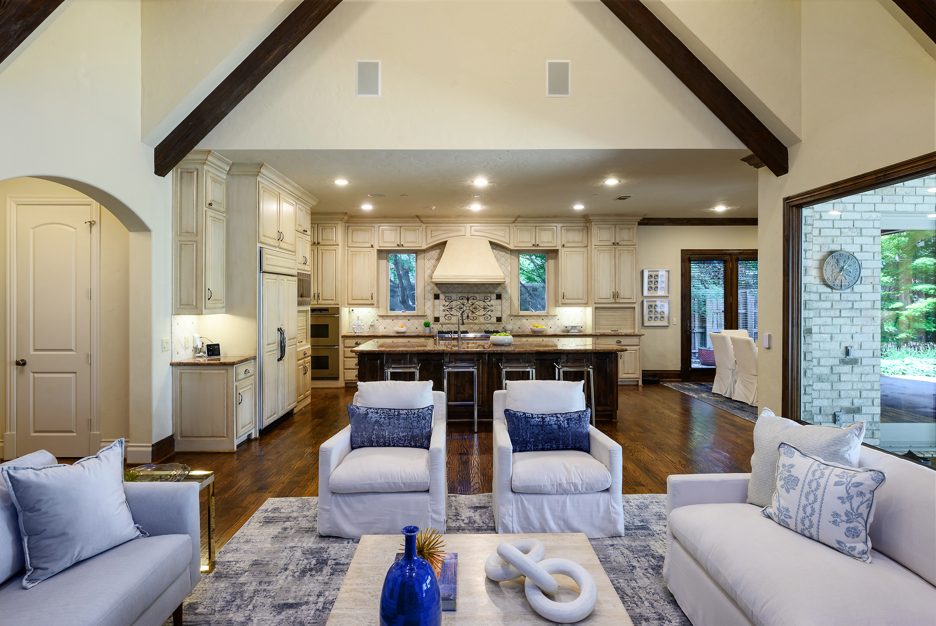 11503 West Ricks Circle Dallas, TX 75230 - Photo 13 of 39 a living room with furniture kitchen and a chandelier