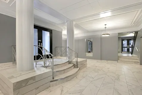 a view of a chair and table in the backyard of the house